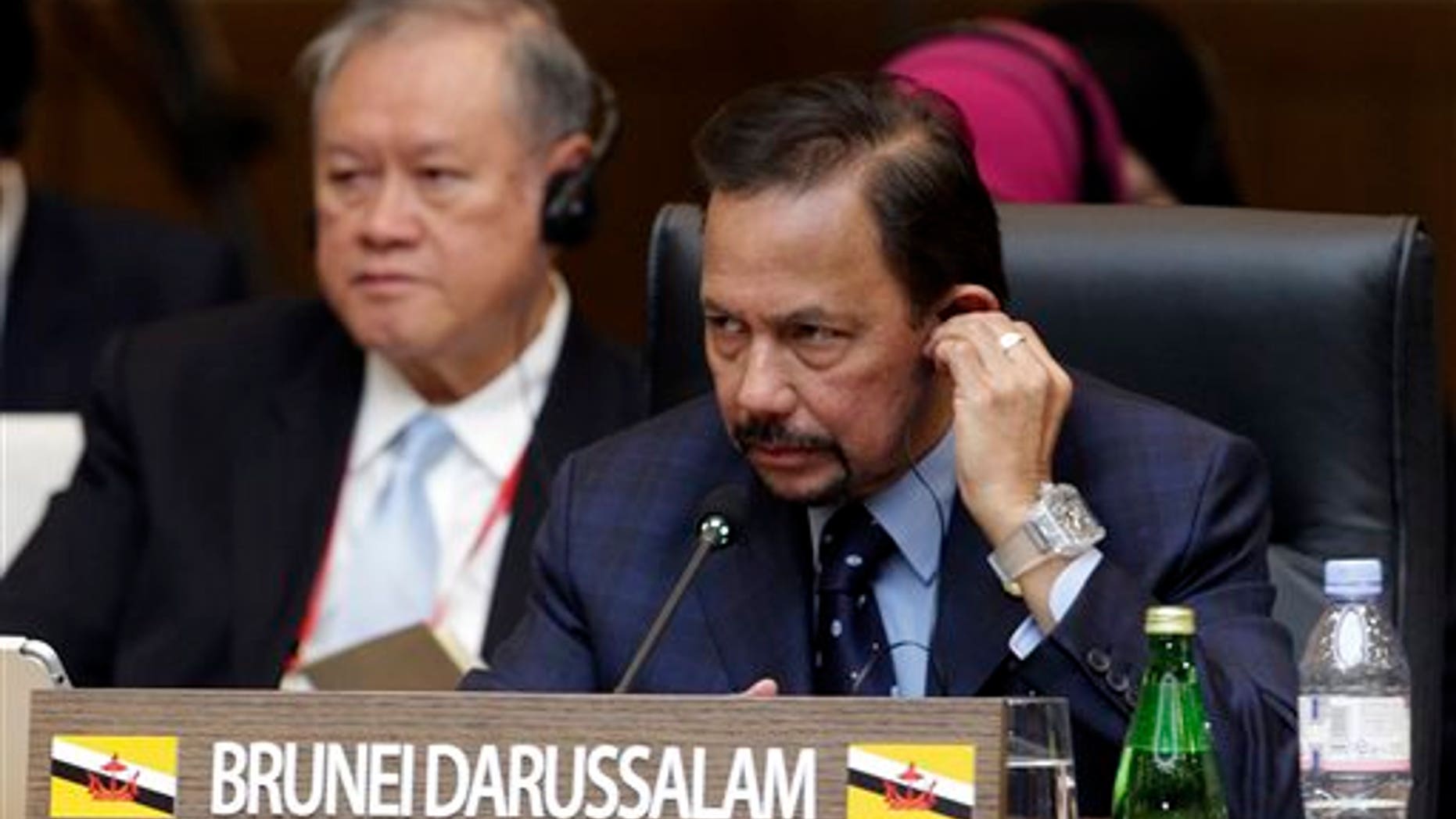 Brunei Sultan Hassanal Bolkiah attends the formal session of the ASEAN-Republic of Korea Commemorative Summit in Busan, South Korea, Friday, Dec. 12, 2014. (AP Photo/Ahn Young-joon, Pool)