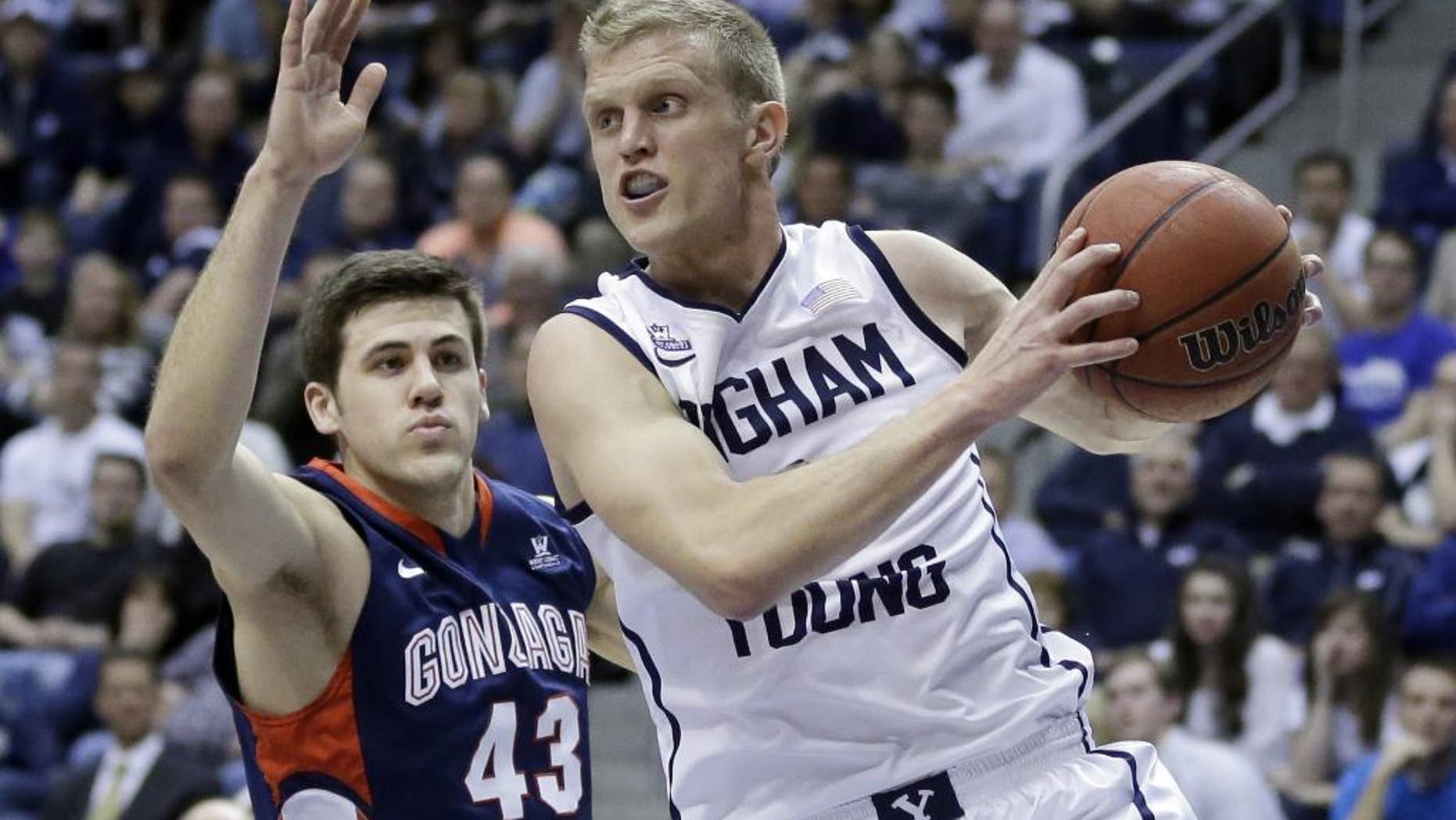 FILE - In this Feb. 20, 2014, file photo, Brigham Young's Tyler Haws (3) pulls down a rebound as Gonzaga's Drew Barham (43) defends in the second half of an NCAA college basketball game in Provo, Utah. By the time this season is over, Haws' name could be the one at the top of the BYU record books. (AP Photo/Rick Bowmer, File)