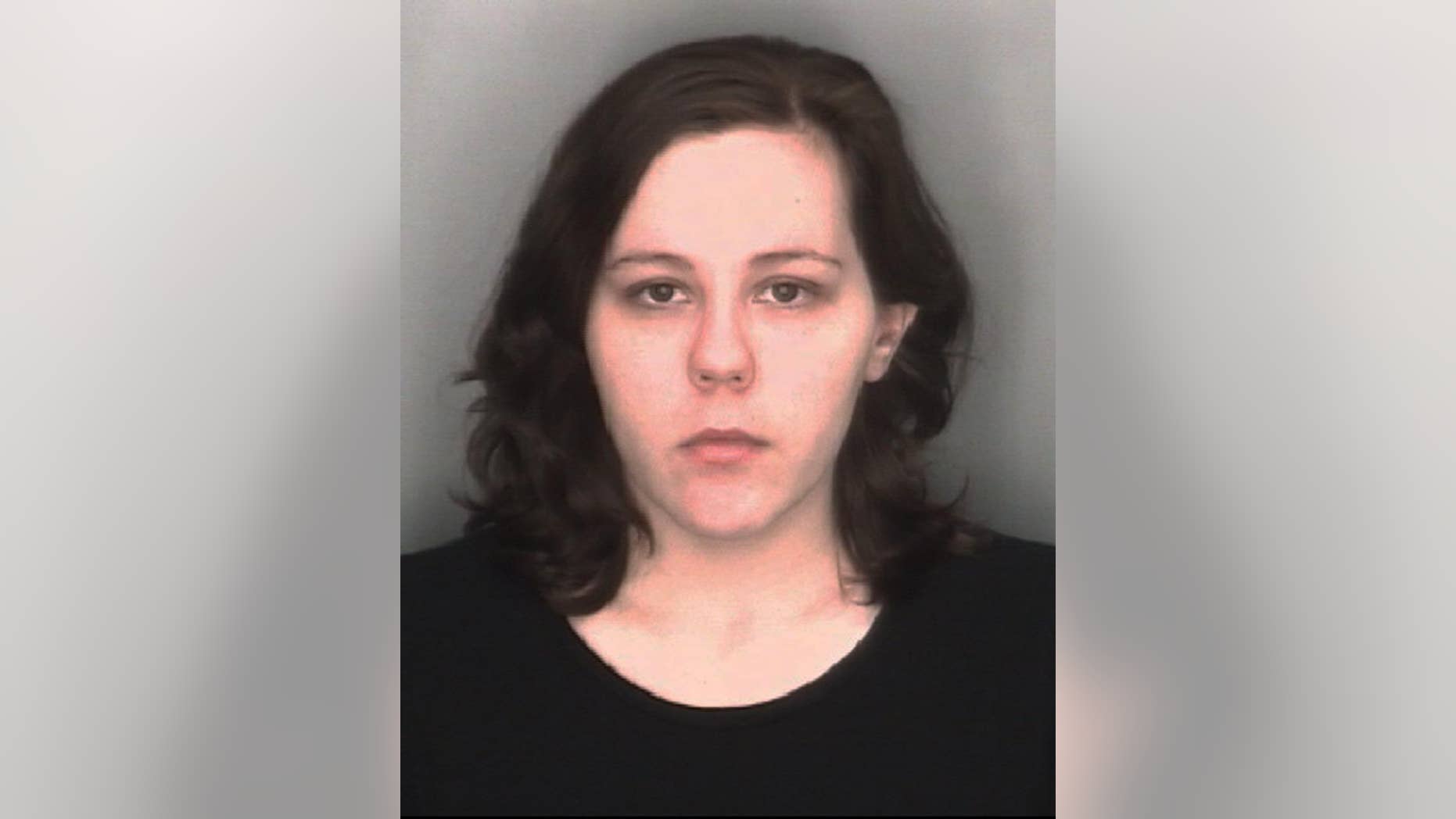 In this undated booking photo released by the Redford Township, Mich., Police Department, Kimberly Pappas, 26, is shown. The Detroit-area woman accused of giving birth at work and hiding the boy in a plastic bag in a desk drawer was ordered Monday, Aug. 24, 2015, to stand trial on murder and child abuse charges. (Redford Township Police Department via AP)