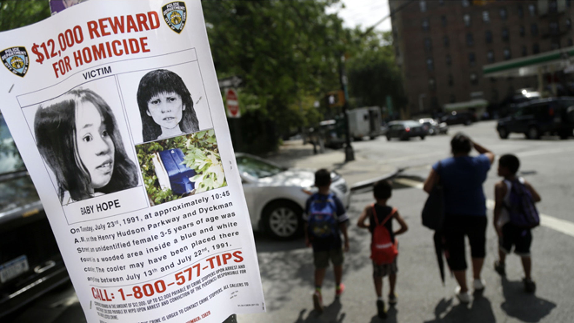 This Tuesday, July 23, 2013, photo shows a poster soliciting information regarding an unidentified body near the site where the body was found in New York. (AP Photo/Seth Wenig)