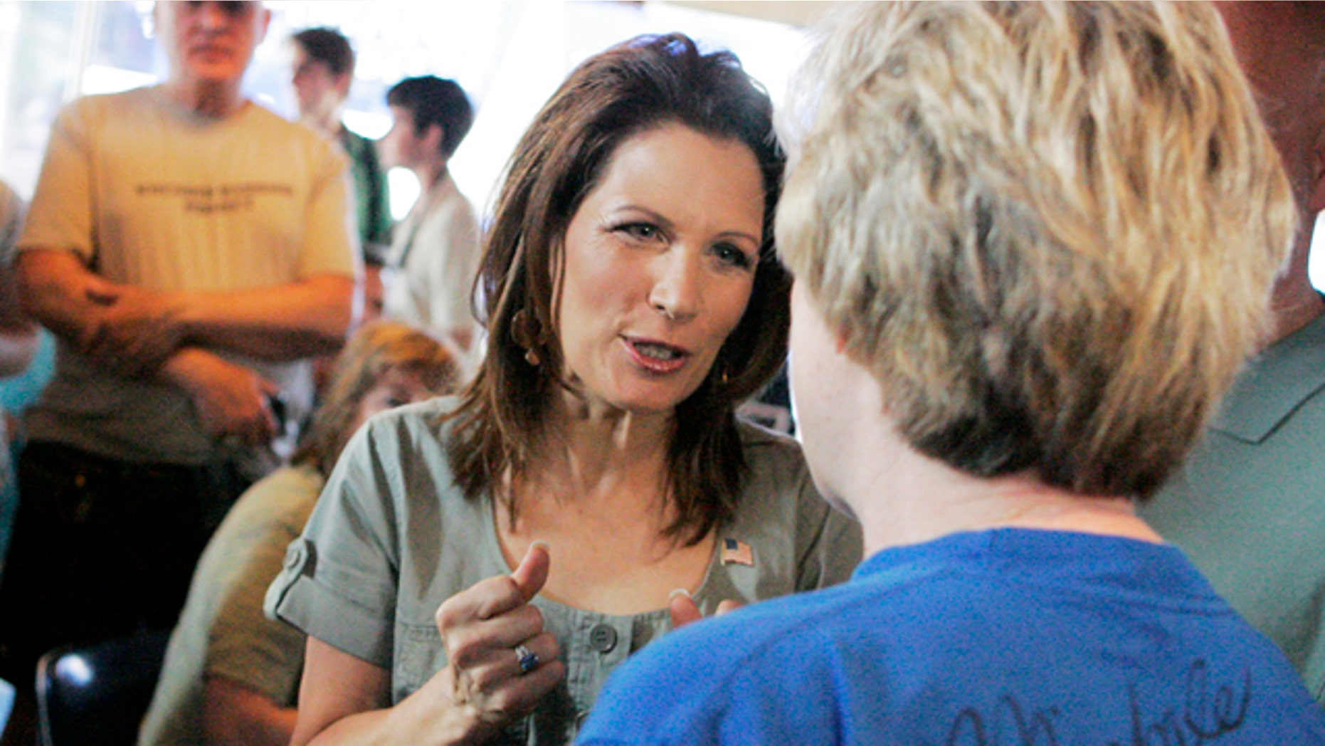 July 2: GOP presidential candidate Michele Bachmann speaks with a potential voter in Iowa City.