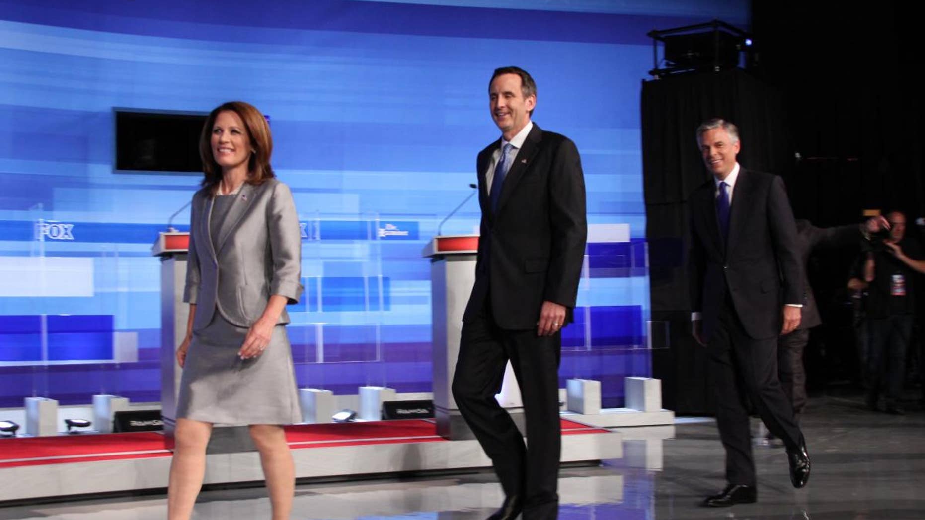 Candidates Michele Bachmann, Tim Pawlenty and Jon Huntsman take the stage at Thursday's Fox News, Washington Examiner, Iowa GOP presidential debate. (Fox News Photo)