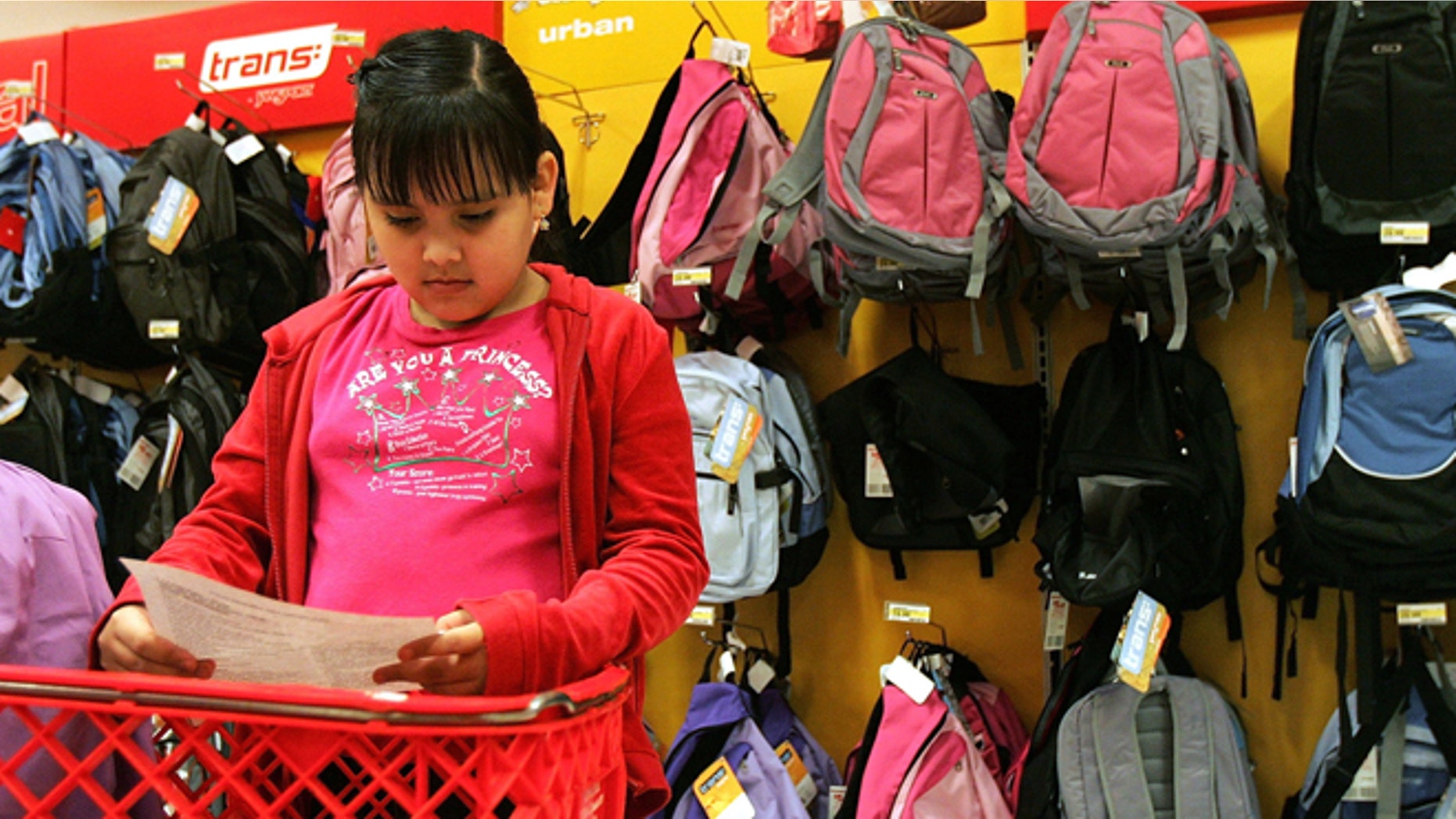 ROSEMONT, IL - AUGUST 11: Patricia Zaragoza, 9, checks her back-to-school shopping list at a Target store August 11, 2005 in Rosemont, Illinois. With the start of school nearing, retailers are stocking up in anticipation of back-to-school shoppers. (Photo by Tim Boyle/Getty Images)