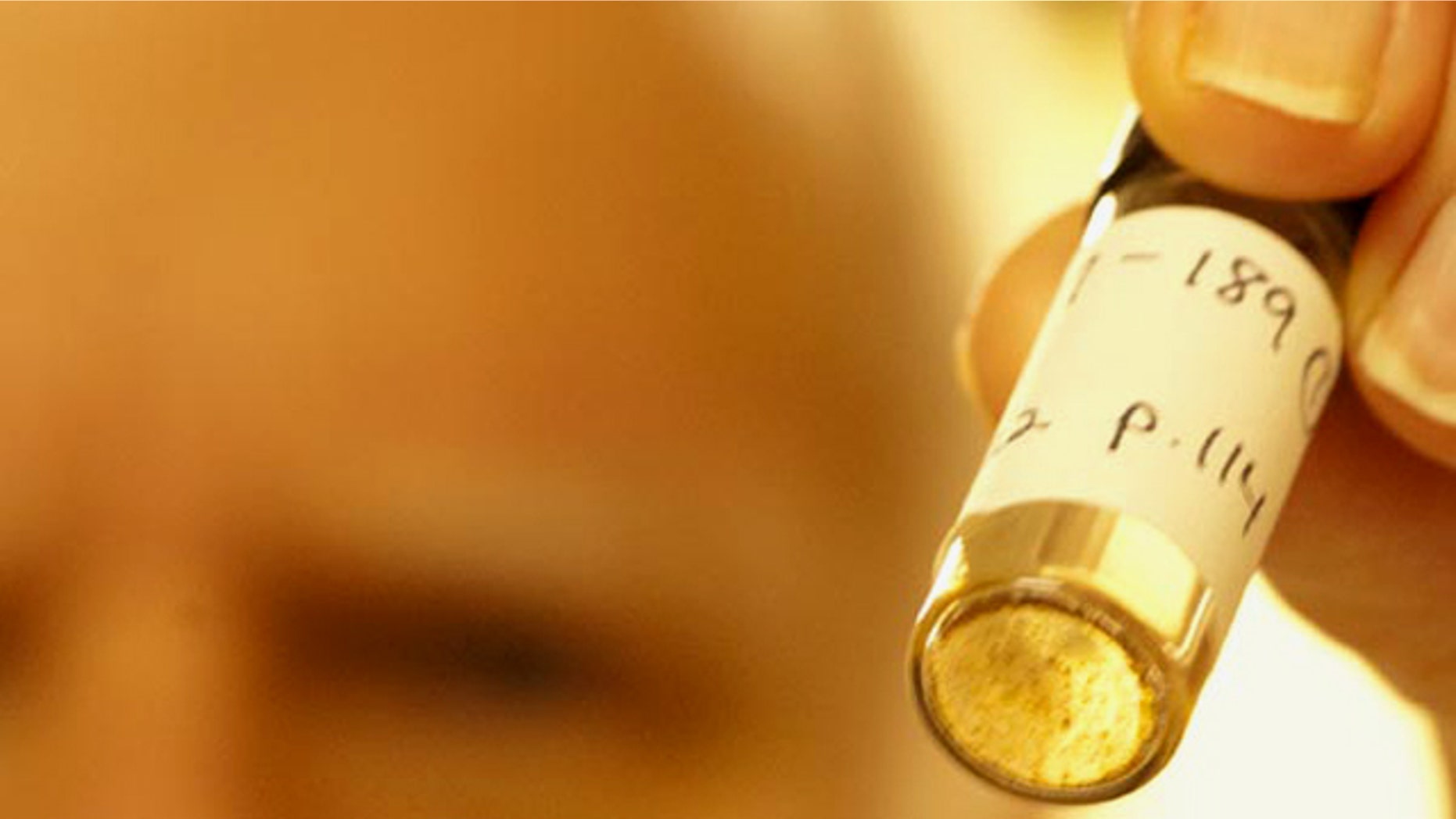 Jeffrey Bada holds a preserved sample containing amino acids created by a 1958 experiment done by his mentor Stanley Miller. The results of this previously unanalyzed experiment have implications for our understanding of how life originated.