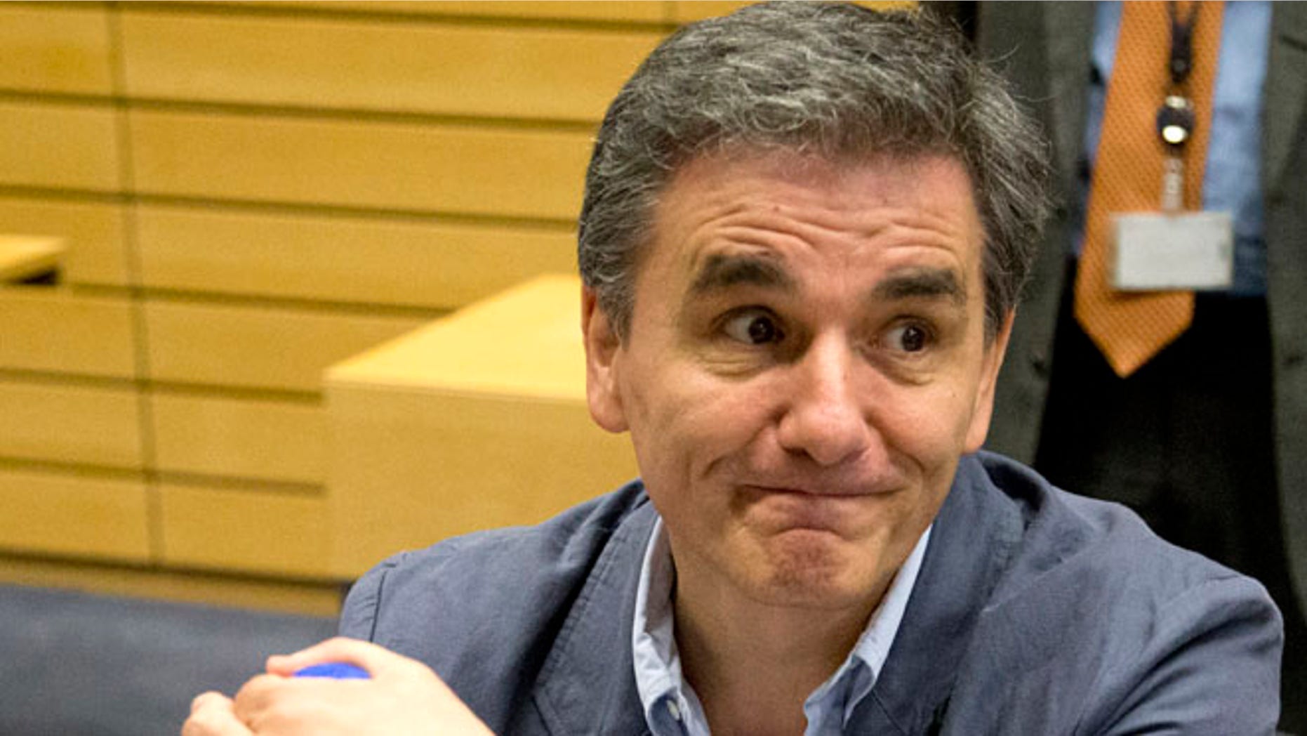 July 7: Greek Finance Minister Euclid Tsakalotos waits for the start of a round table meeting of eurozone finance ministers in Brussels.