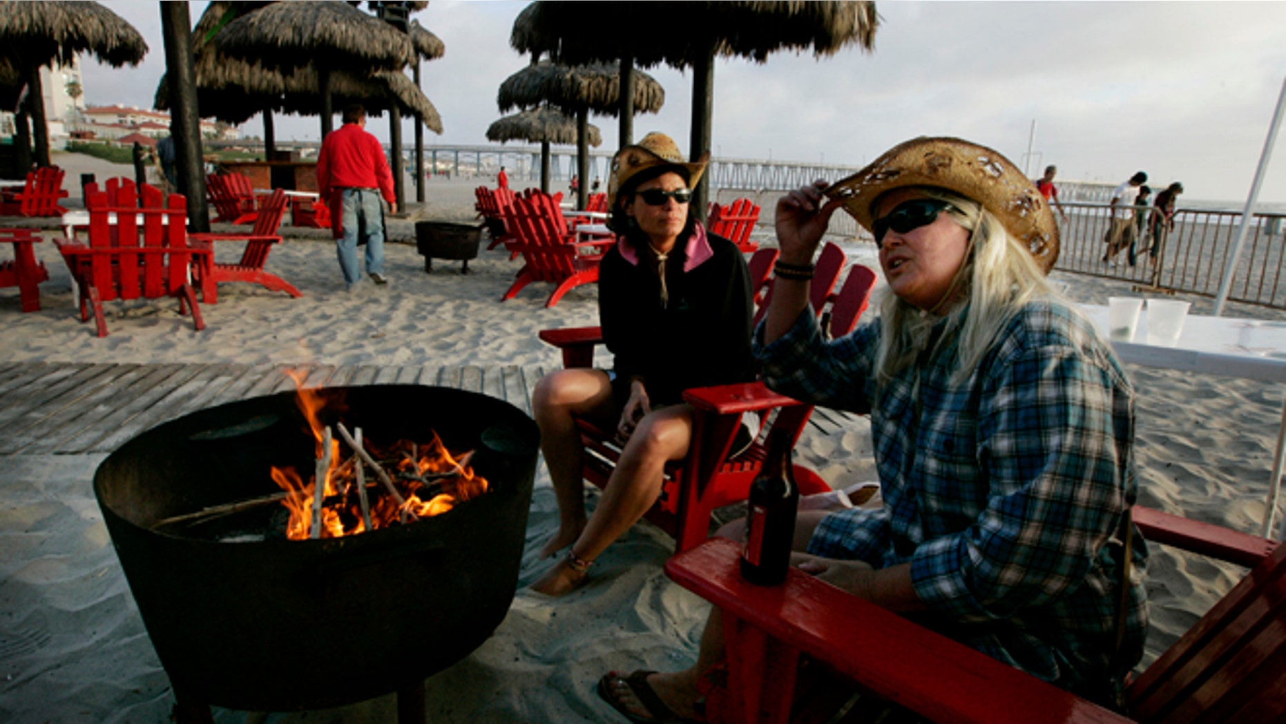ROSARITO, MEXICO - APRIL 1: Carol Arthur (R) and Tammy Delu, from Seattle, sit at a bar along the beach April 1, 2009 in Rosarito, Mexico. (Photo by Sandy Huffaker/Getty Images)