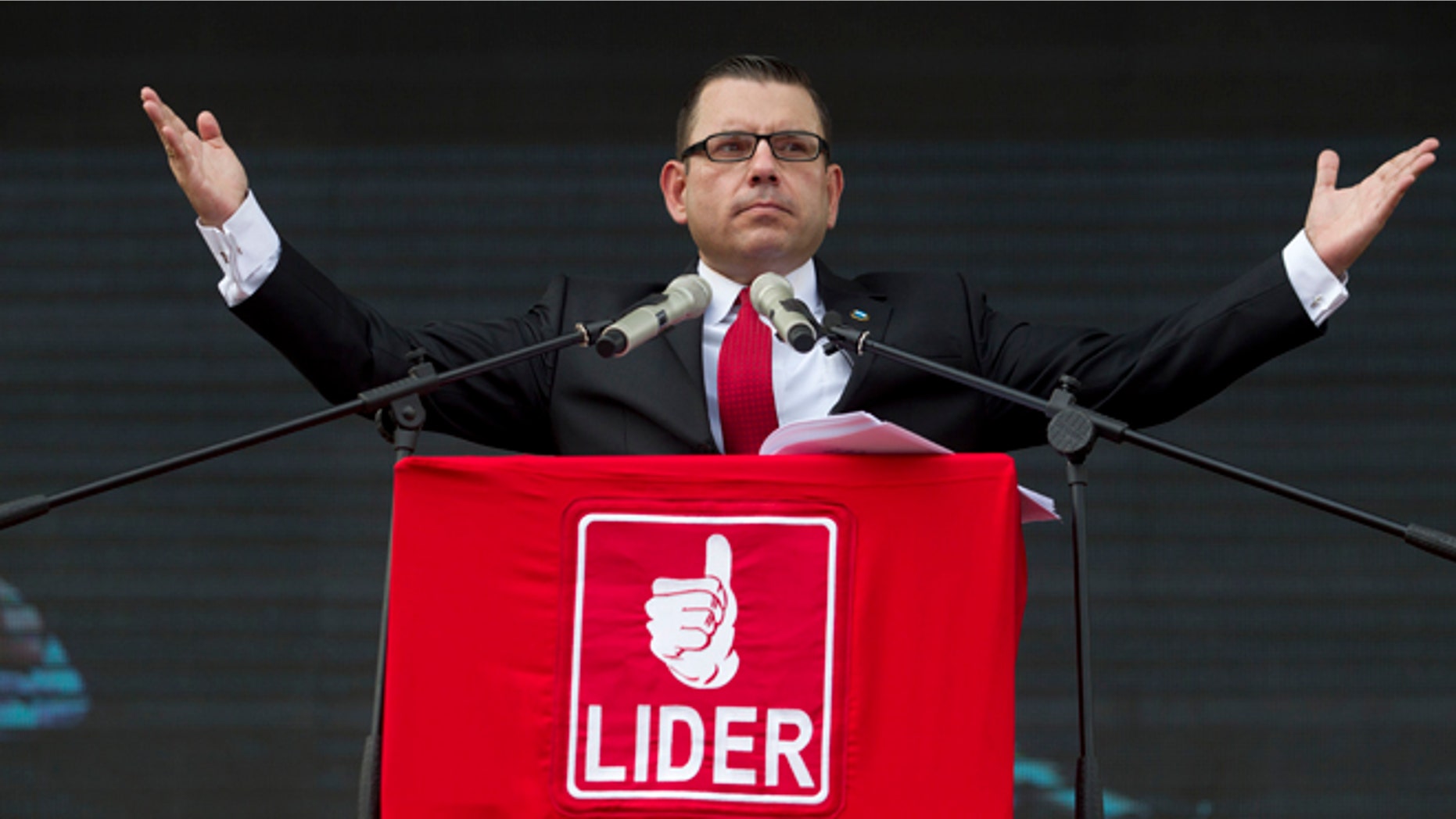 FILE - In this May 3, 2015, file photo, Manuel Baldizon, presidential candidate of the Democratic Freedom Revival Party, speaks during a campaign rally in Guatemala City. Baldizon quit his political party and dropped out of the race on Monday, Sept. 14, 2015, leaving a television comedian and a former first lady to vie in the runoff to be the countrys next president. (AP Photo/Moises Castillo, File)