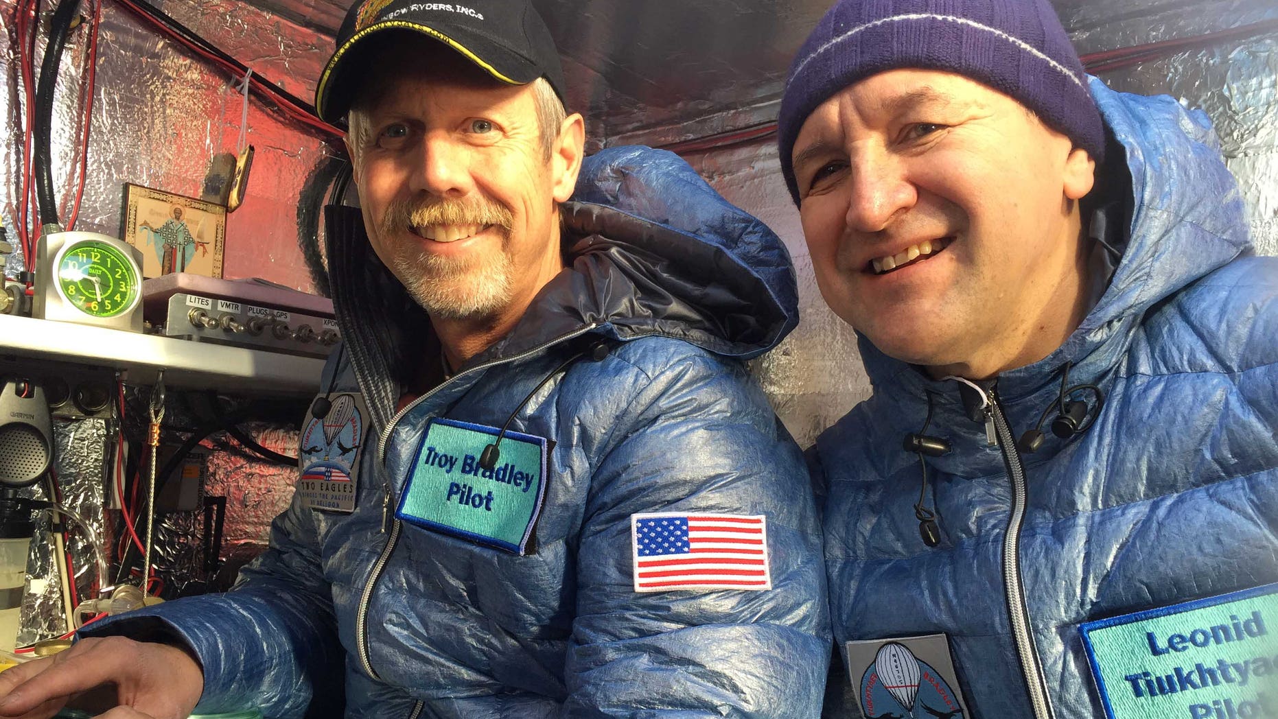 This Jan. 8, 2015 photo provided by Tami Bradley-Two Eagles Balloon Team, shows pilots from left, Troy Bradley of Albuquerque, N.M., and Leonid Tiukhtyaev of Russia, before they lift off in a gas balloon in Saga, Japan. The Two Eagles pilots have traveled farther and longer in a gas balloon than anyone in history in a bid to remove the qualifiers that have complicated a century of record keeping in long-distance ballooning. Now they're aiming for a safe landing on the beaches of Baja California. (AP Photo/Tami Bradley-Two Eagles Balloon Team)