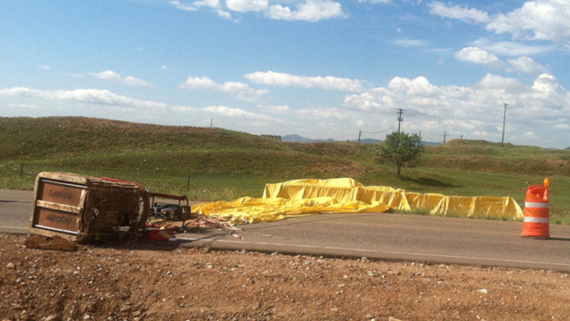 June 8, 2013: This photo provided by the Arvada (Colo.) Fire Department shows a hot air balloon that crashed, Saturday, June 8, 2013 in Arvada, Colo. Authorities say gusty winds sweeping through the Denver area Saturday caused several hot air balloon crashes that injured at least five people.