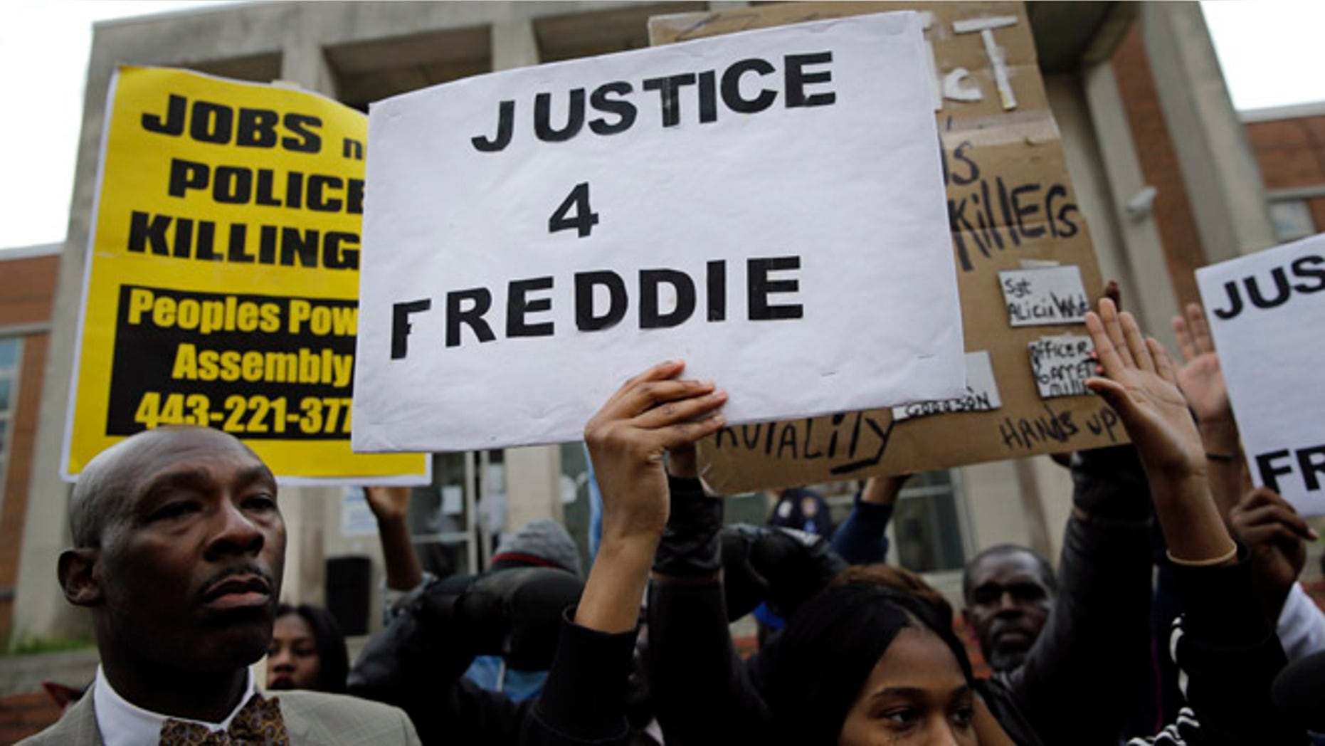 April 21: Protestors stand outside of the Baltimore Police Department's Western District police station during a march and vigil for Freddie Gray.