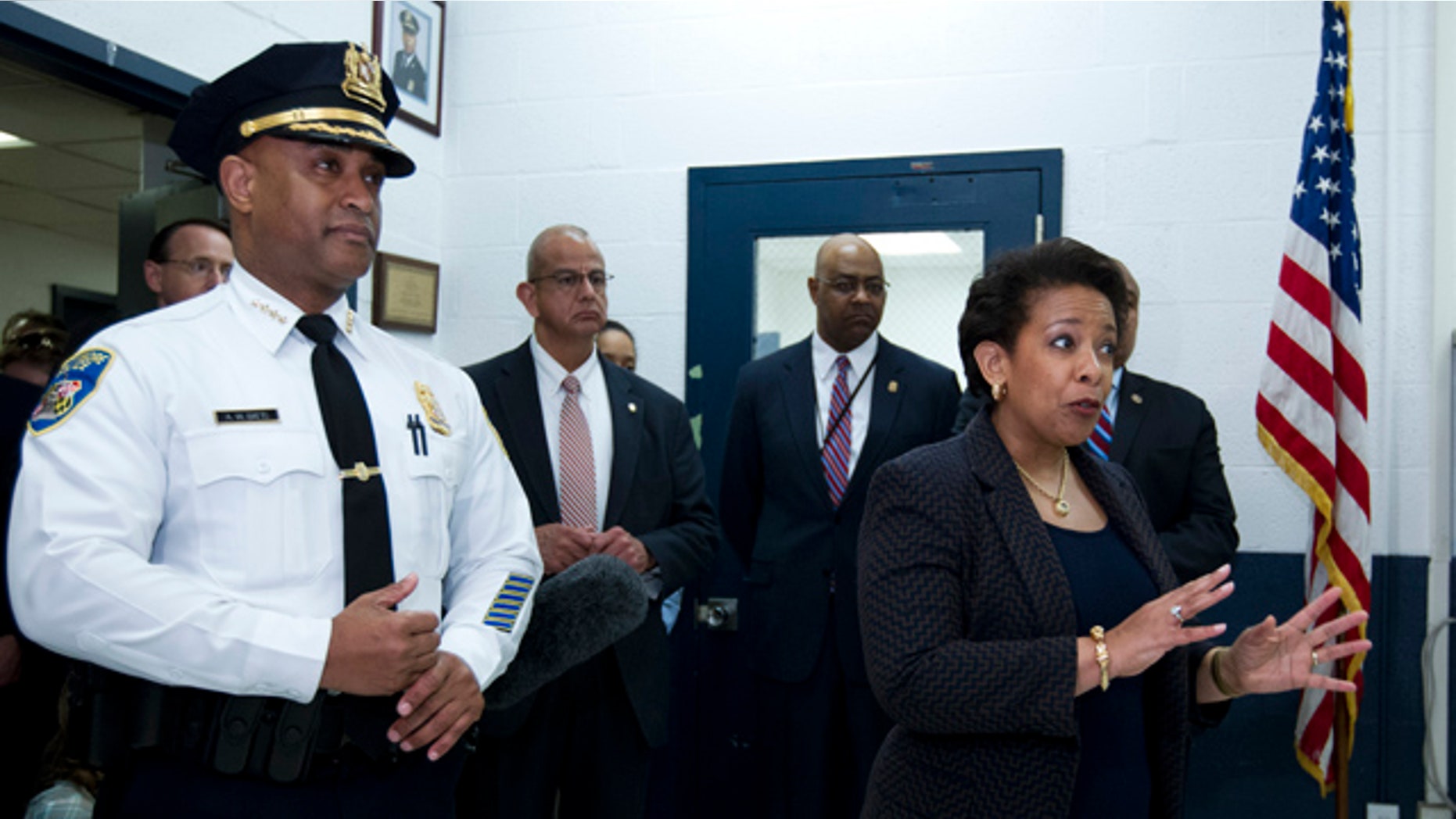 May 5, 2015: Attorney General Loretta Lynch, right, accompanied by Baltimore police Commissioner Anthony Batts, speaks to Baltimore police officers during a visit to the Central District of Baltimore Police Department. (AP Photo/Jose Luis Magana, Pool)