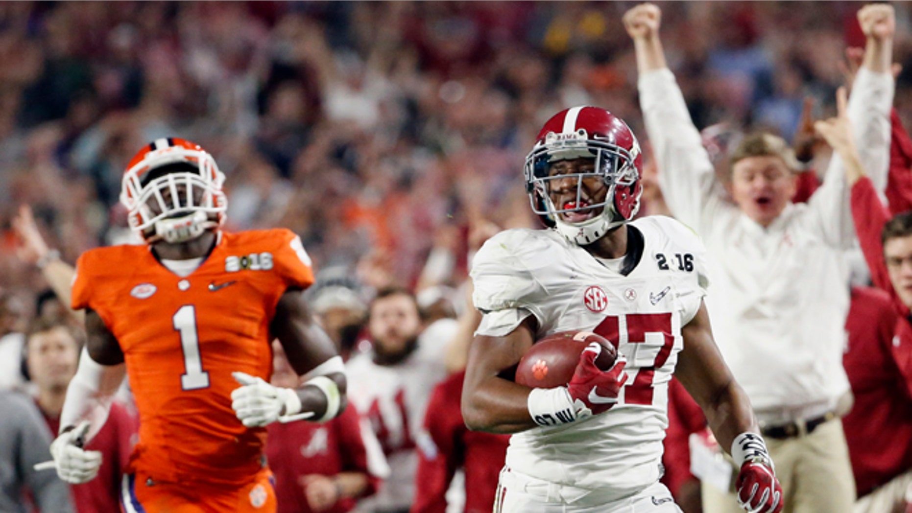 Alabama's Kenyan Drake, right, breaks away for a touchdown return against Clemson's Jayron Kearse (1) during the second half of the NCAA college football playoff championship game Monday, Jan. 11, 2016, in Glendale, Ariz. (Michael Chow/The Arizona Republic via AP) MARICOPA COUNTY OUT; MAGS OUT; NO SALES; MANDATORY CREDIT