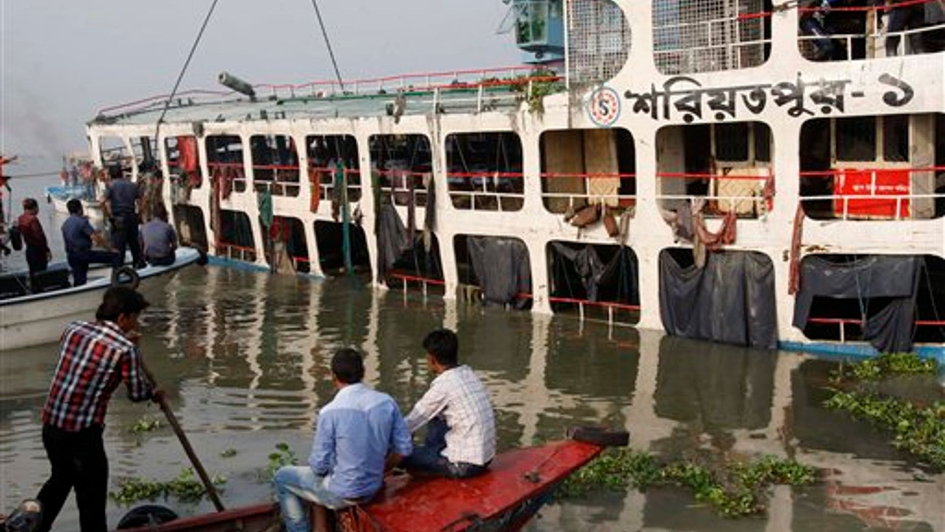 March 14: Recovery workers attempt to lift the wreckage of a ferry that capsized in the Meghna River in Munshiganj district, about 20 mile south of Dhaka, Bangladesh.