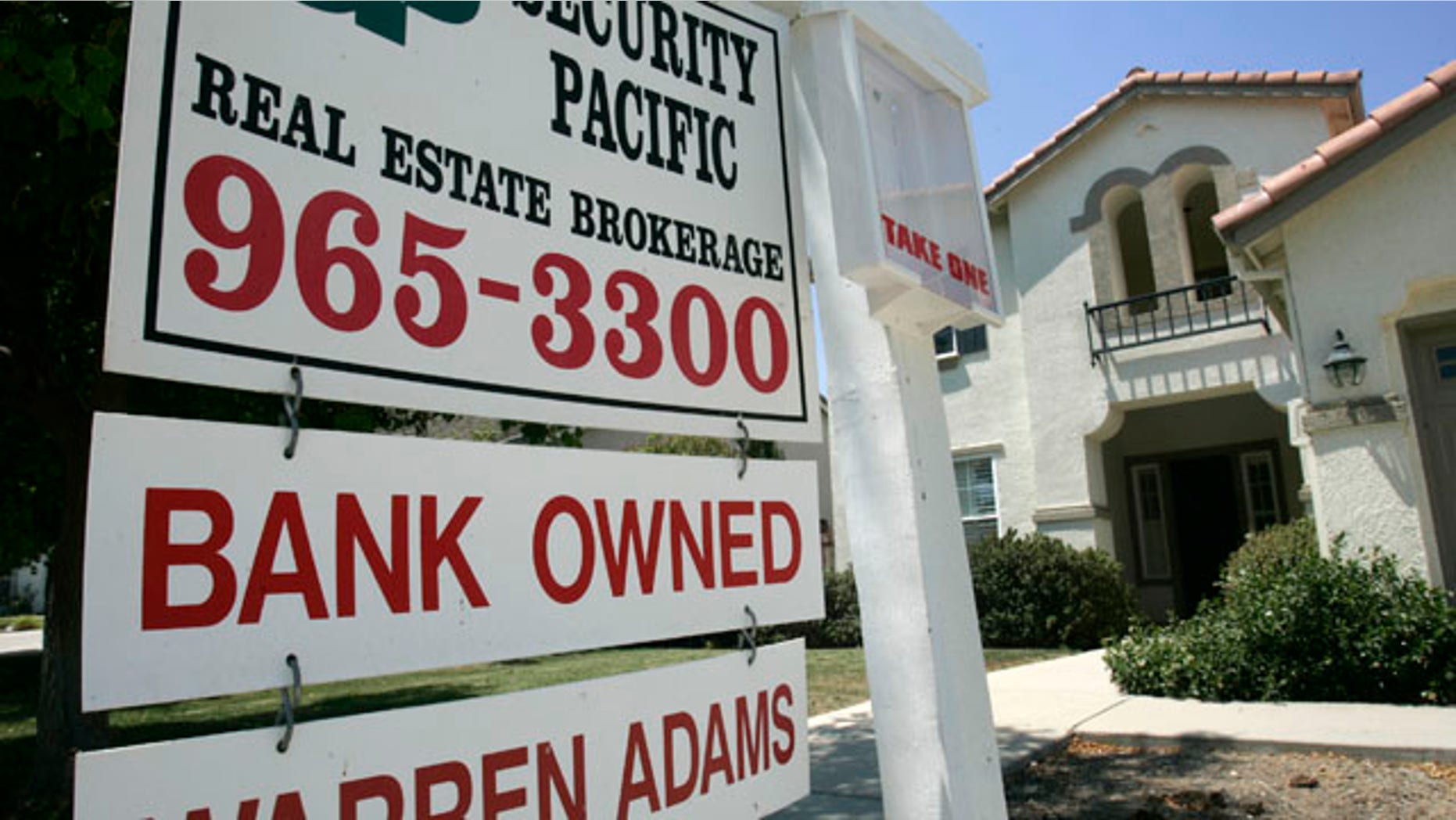 FILE - In this July 2, 2008 file photo, a bank owned home is seen for sale in Sacramento, Calif. The foreclosure crisis intensified across a majority of large U.S. metropolitan areas this summer, with Chicago and Seattle _ cities outside of the states that have shouldered the worst of the housing downturn _ seeing a sharp increase in foreclosure warnings. California, Nevada, Florida and Arizona remain the nation's foreclosure hotbeds, accounting for 19 of the top 20 metropolitan areas with the highest foreclosure rates between July and September, foreclosure listing firm RealtyTrac Inc. said Thursday Oct. 28, 2010. (AP Photo/Rich Pedroncelli, file)