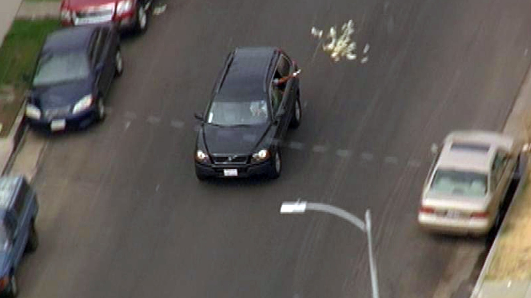 Sept. 12, 2012: Bank robbery suspects throw money from their vehicle during a police pursuit.