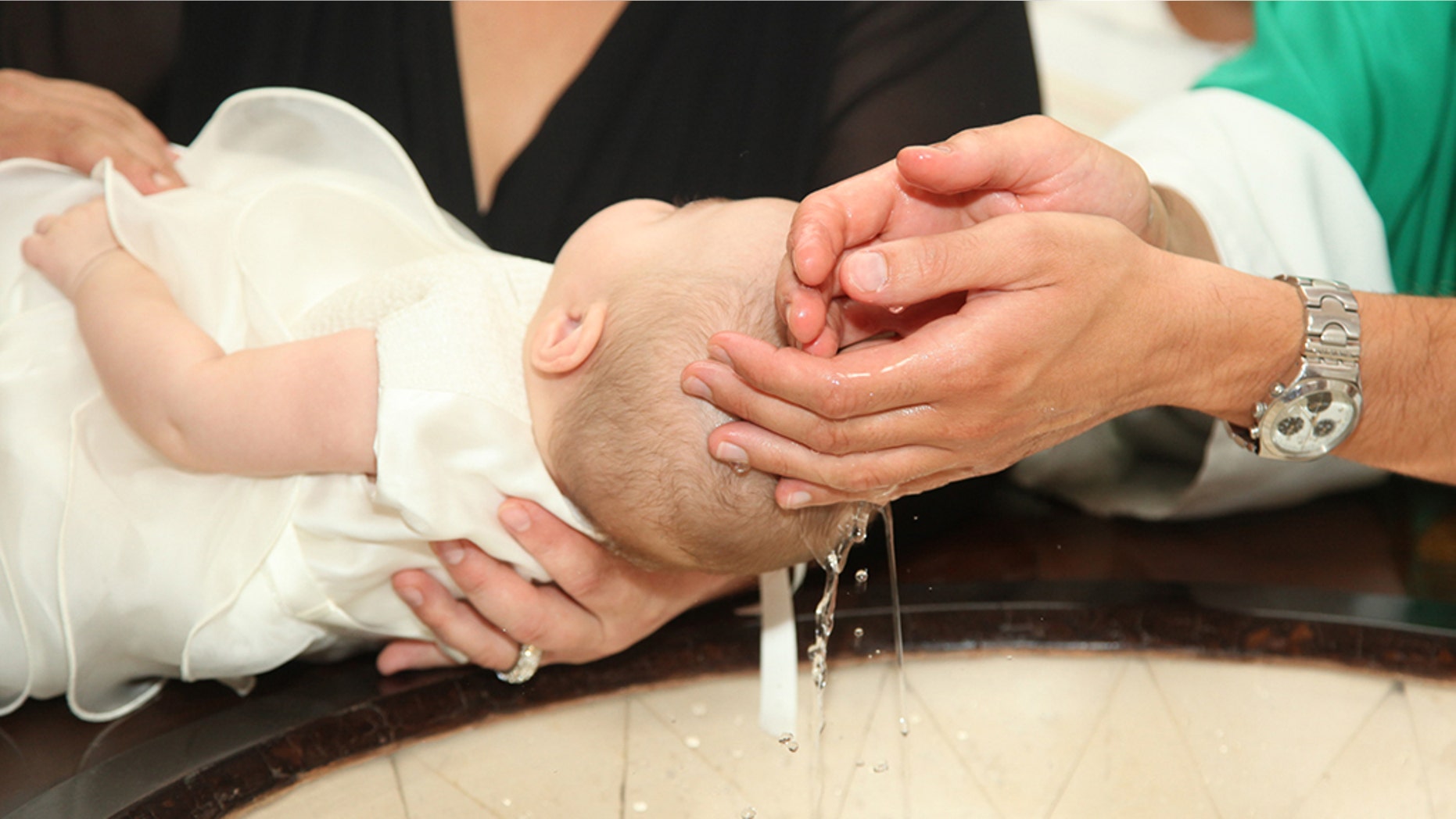 A French priest was suspended after a viral video showed him slapping a baby during a baptism ceremony.