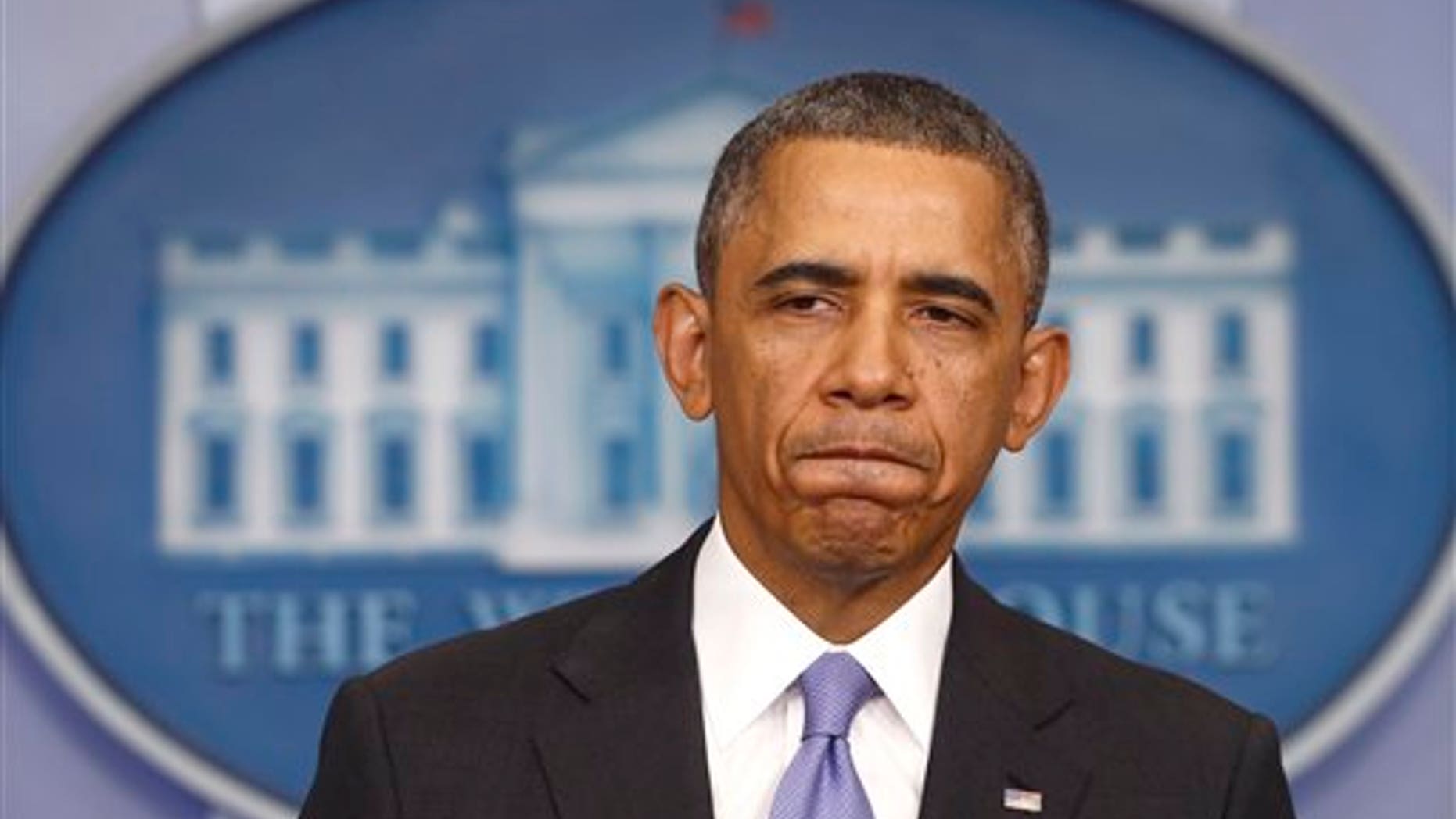FILE - In this Nov. 14, 2013 file photo, President Barack Obama pauses while speaking about his signature health care law, in the Brady Press Briefing Room of the White House in Washington. (AP Photo/Charles Dharapak, File)