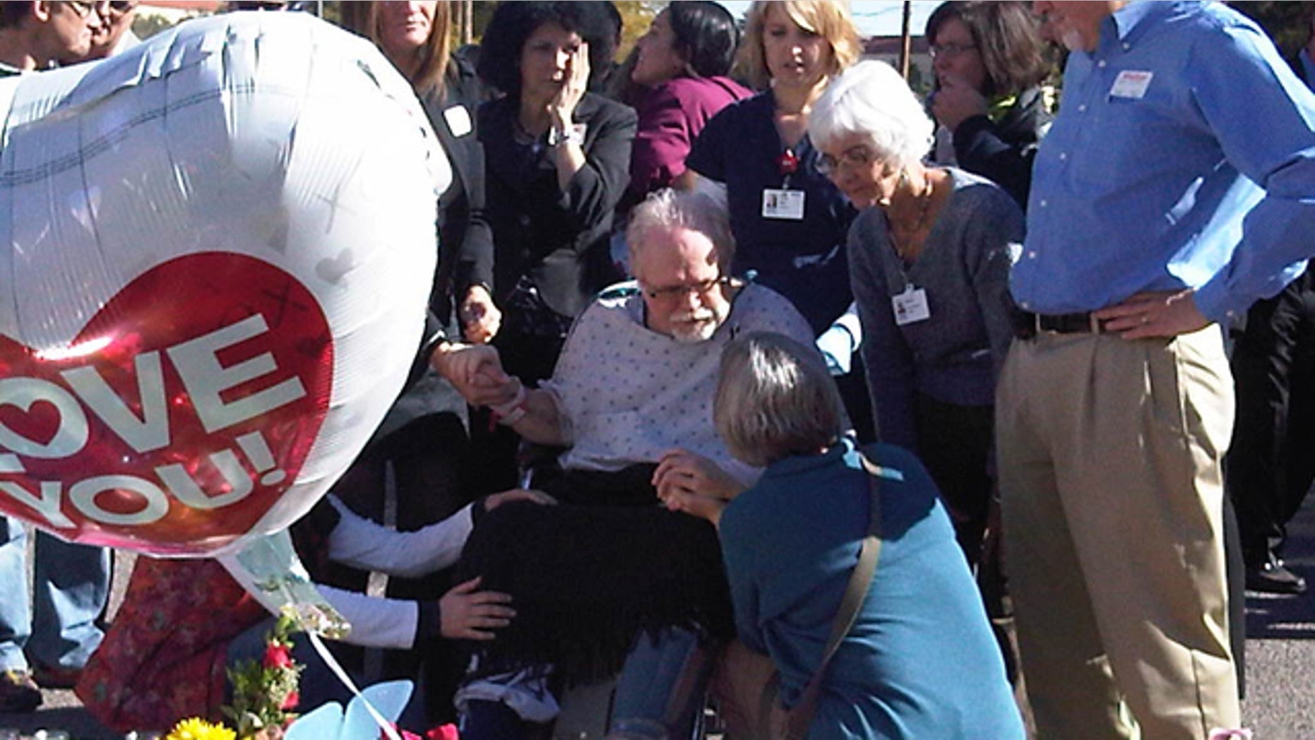Jan. 13: Ron Barber, an aide to Giffords who was shot in the cheek, leaves the hospital for the first time to visit well-wishers and view a makeshift memorial.