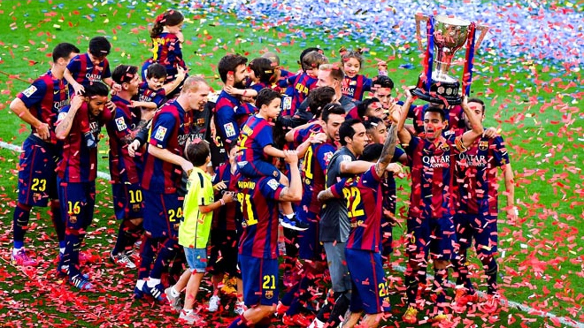 FC Barcelona players celebrate with La Liga trophy at Camp Nou on May 23, 2015 in Barcelona, Spain.