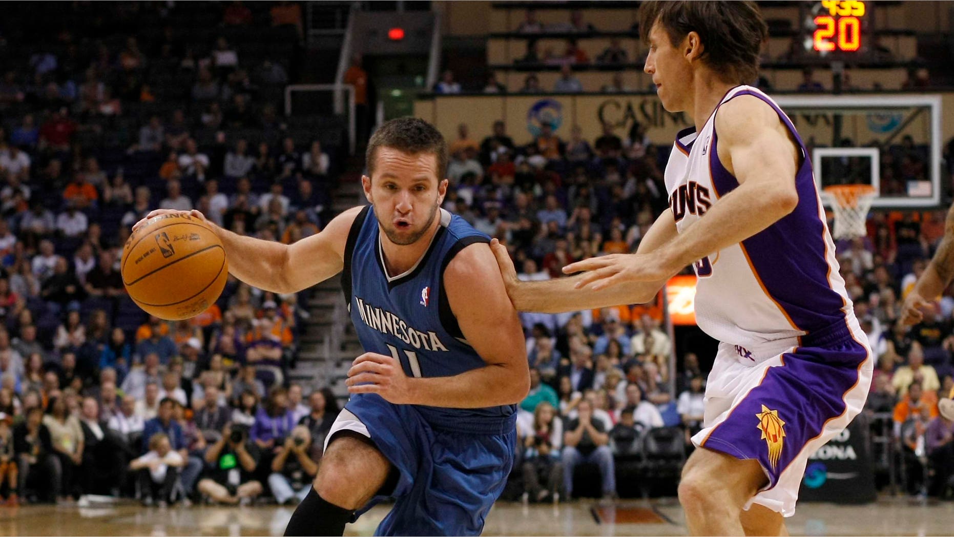 Minnesota Timberwolves guard Jose Barea, left, of Puerto Rico, drives on Phoenix Suns guard Steve Nash in the second quarter during an NBA basketball game on Monday, March 12, 2012, in Phoenix.