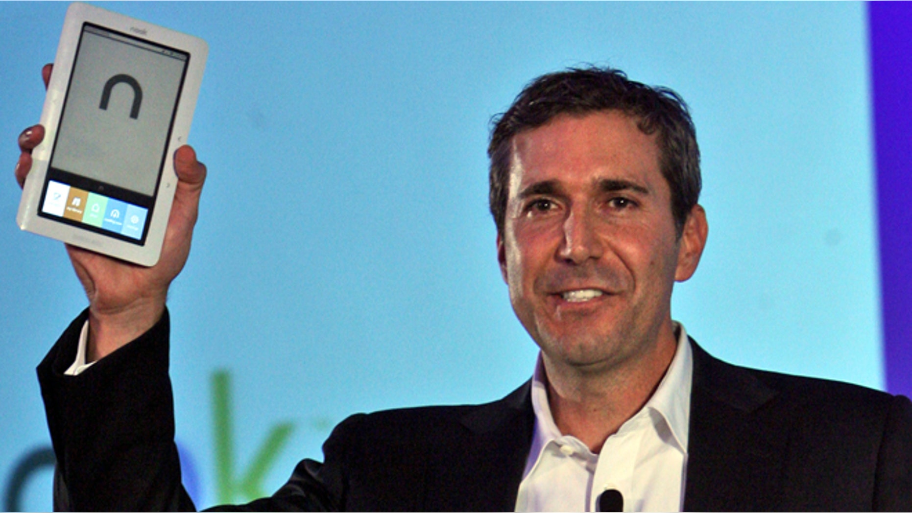 In this Oct. 20, 2009 file photo, William Lynch, then president of Barnes & Noble.com, unveils the "nook" electronic-book reader during a news conference in New York.