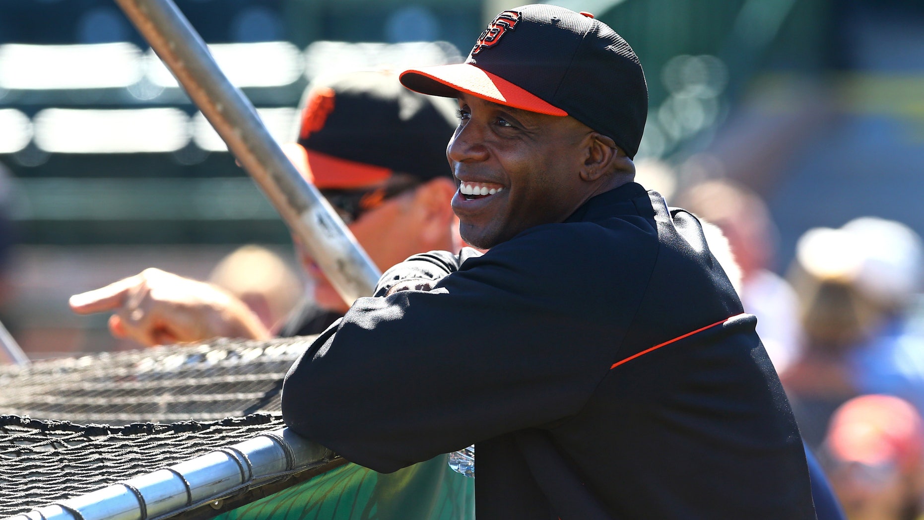 Mar 10, 2014: San Francisco Giants former outfielder Barry Bonds laughs during batting practice prior to the game against the Chicago Cubs at Scottsdale Stadium.