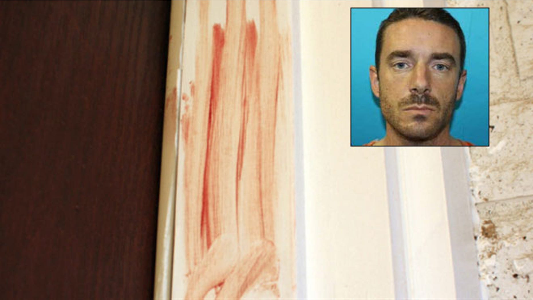 Dec. 12, 2012: Blood is smeared on the door frame at a home in Richland Hills, Texas, where Brent Troy Bartel is accused of using a box cutter to carve a pentagram in his six-year-old son's back.