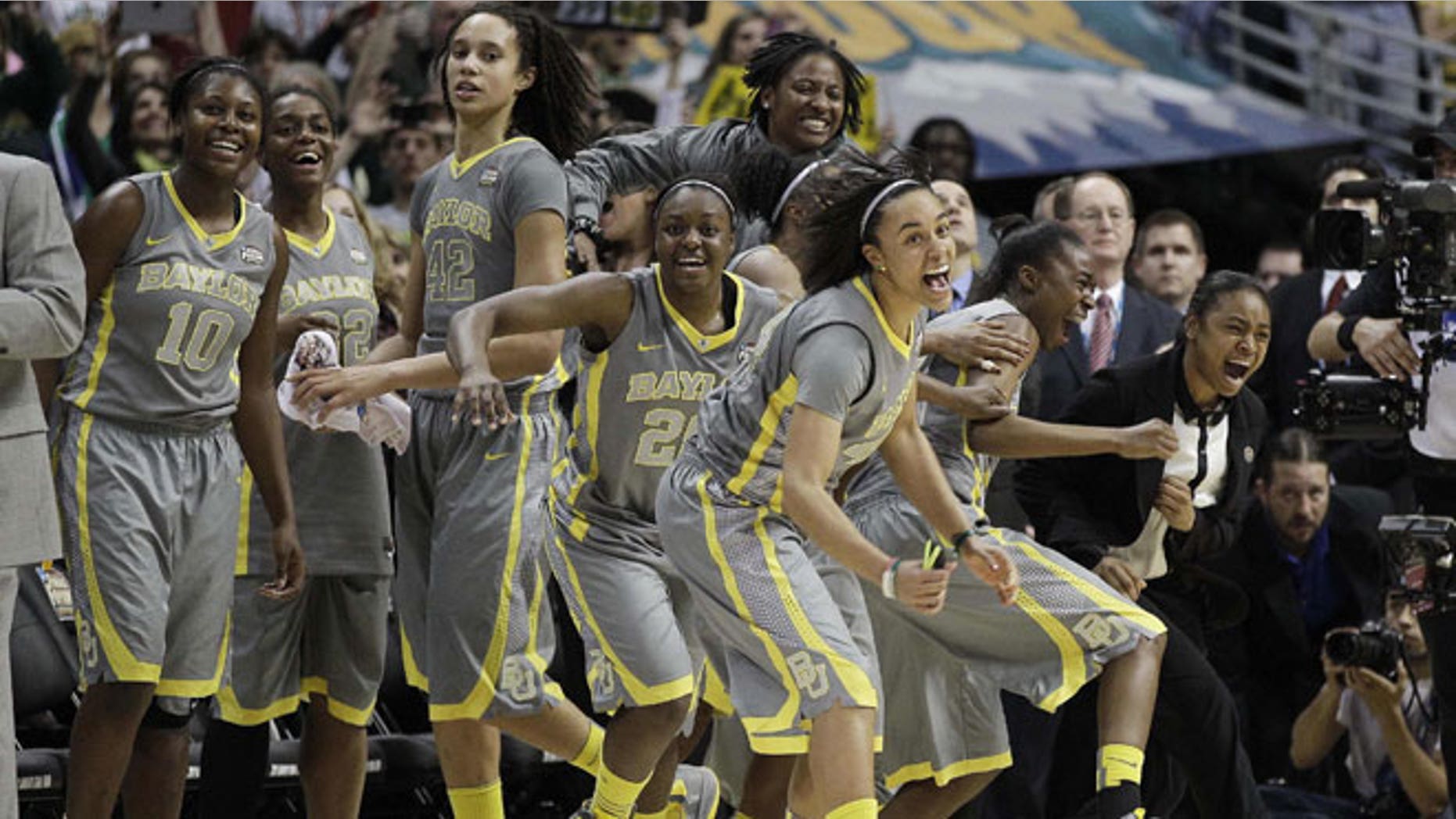 April 3, 2012: The Baylor team explodes off the bench at the end of the second half in the NCAA Women's Final Four college basketball championship game against Notre Dame, in Denver.