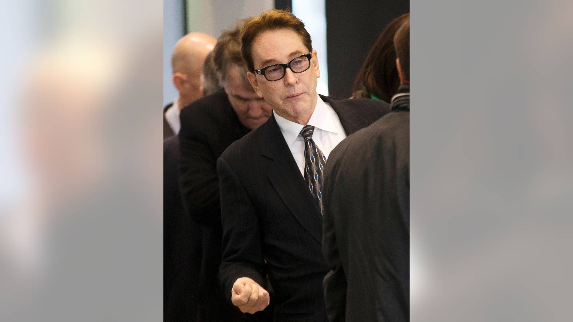 FILE - In this Jan. 14, 2014 file photo, Ty Warner, the billionaire who created Beanie Babies, arrives at federal court where he was sentenced to community service but no prison time for hiding at least $25 million from U.S. tax authorities in Swiss bank accounts. On Wednesday, Sept. 17, 2014, a three-judge appellate panel at the U.S. 7th Circuit Court of Appeals in Chicago is scheduled to hear arguments from prosecutors who say Warner's punishment was way too lenient and from defense attorneys who say it was just right. (AP Photo/Andrew A. Nelles, File)