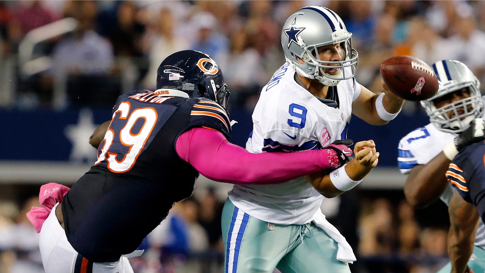 Dallas Cowboys quarterback Tony Romo (9) is sacked by Chicago Bears defensive tackle Henry Melton (69) during the second half ofan NFL football game Monday, Oct. 1, 2012, in Arlington, Texas. The Bears won 34-18. (AP Photo/The Waco Tribune-Herald, Jose Yau)