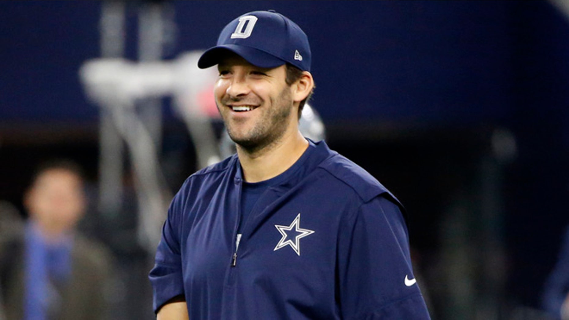 Dallas Cowboys quarterback Tony Romo walks across the field as his team warms up before an NFL football game against the Dallas Cowboys, Sunday, Sept. 25, 2016, in Arlington, Texas. (AP Photo/Ron Jenkins)