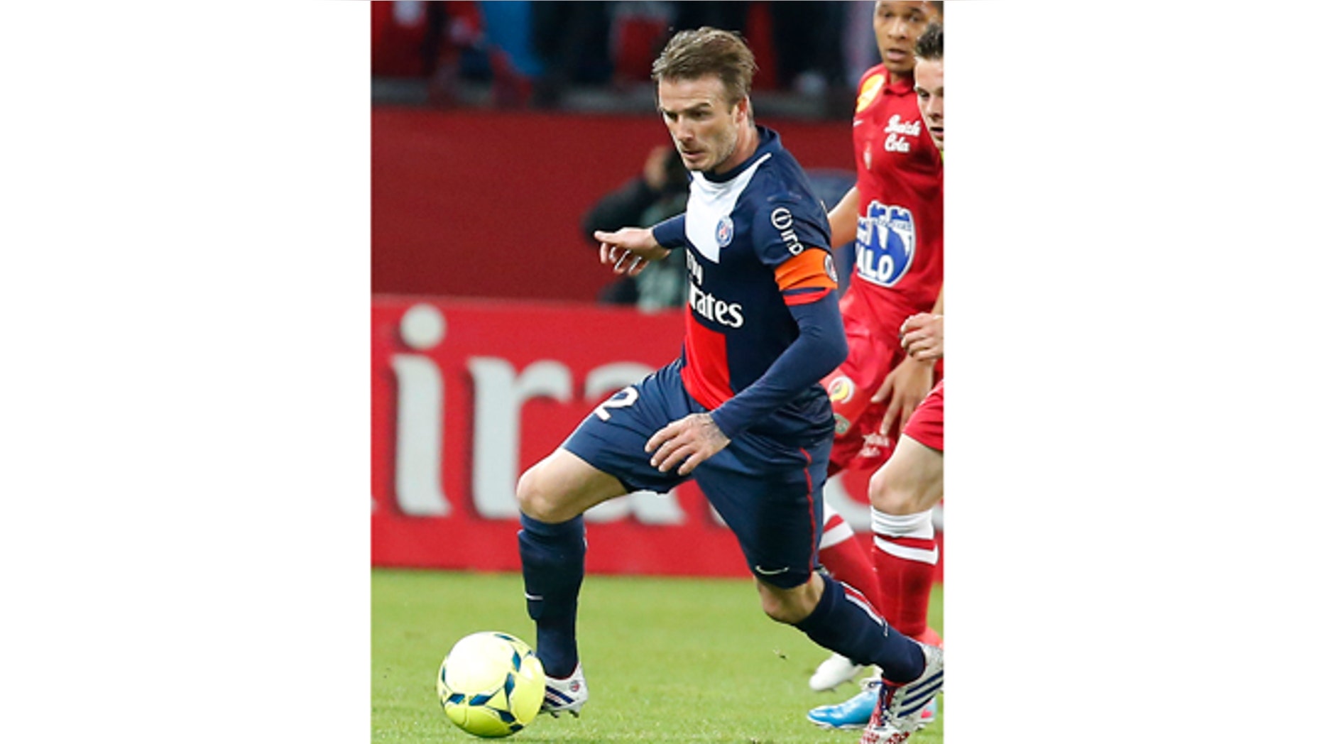 May 18, 2013: In this photo, Paris Saint Germain's David Beckham dribbles the ball during a French League One soccer match against Brest at Parc des Princes Stadium in Paris.