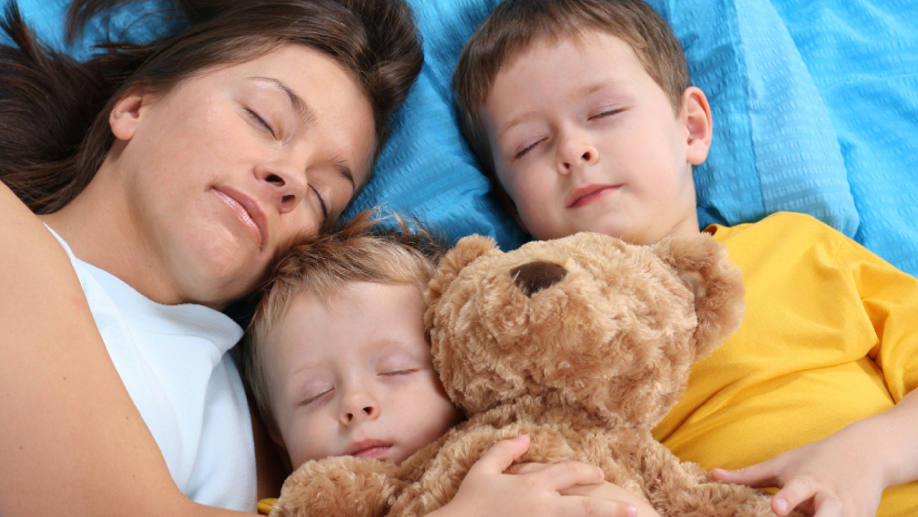 sweet dreams - mother and two sons sleeping