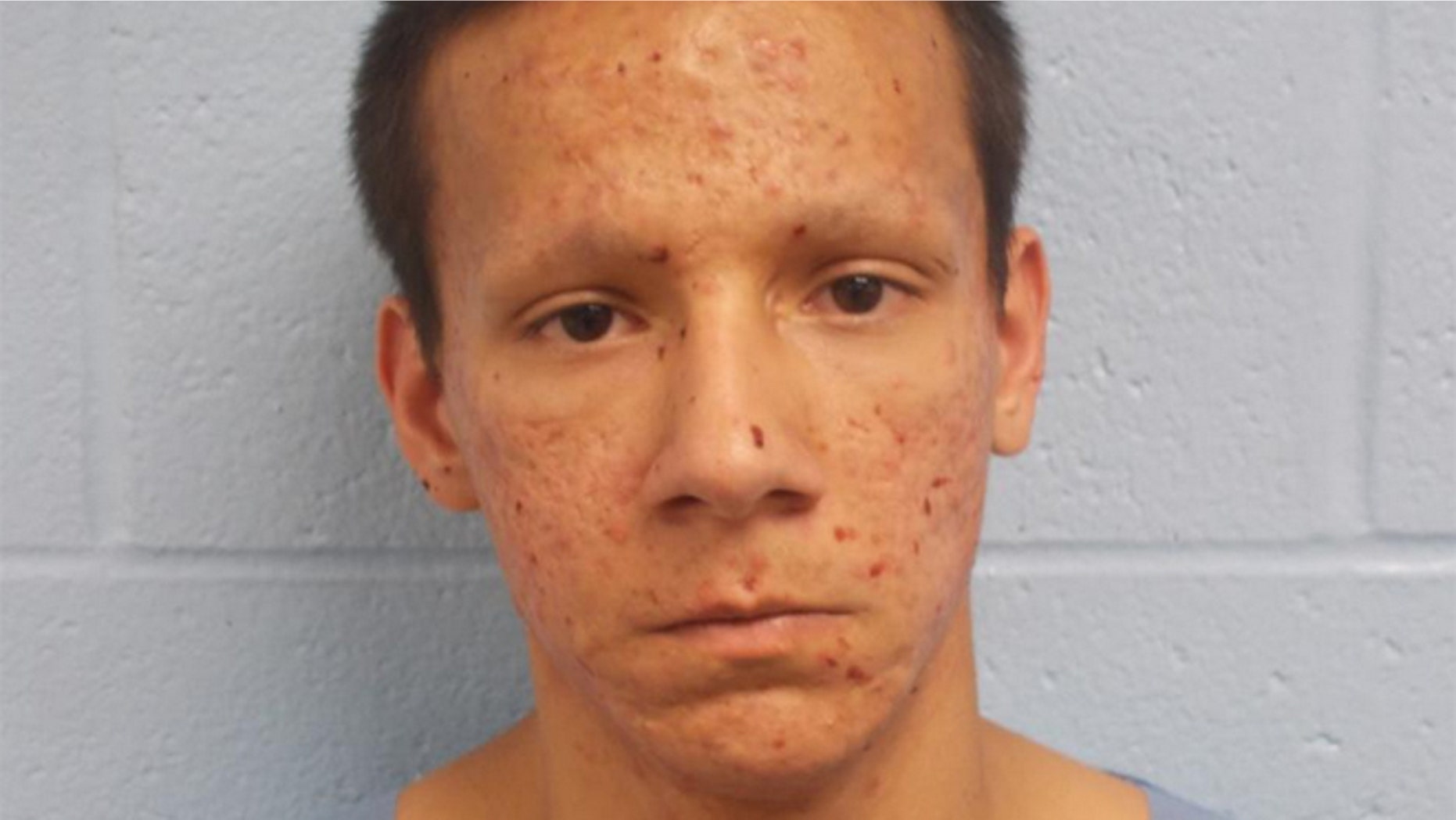 Isaiah Marin, 21, was arrested after police say he called 911 to report that he killed someone. Police reportedly said they found Marin jogging with a long knife.