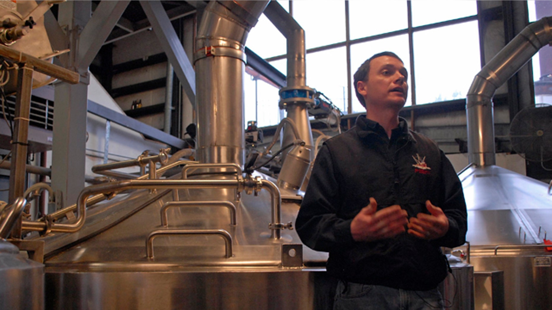 Jan 23, 2013: Brandon Smith, the Alaskan Brewing Co.'s brewing operations and engineering manager, speaks to reporters about the company's new boiler system.