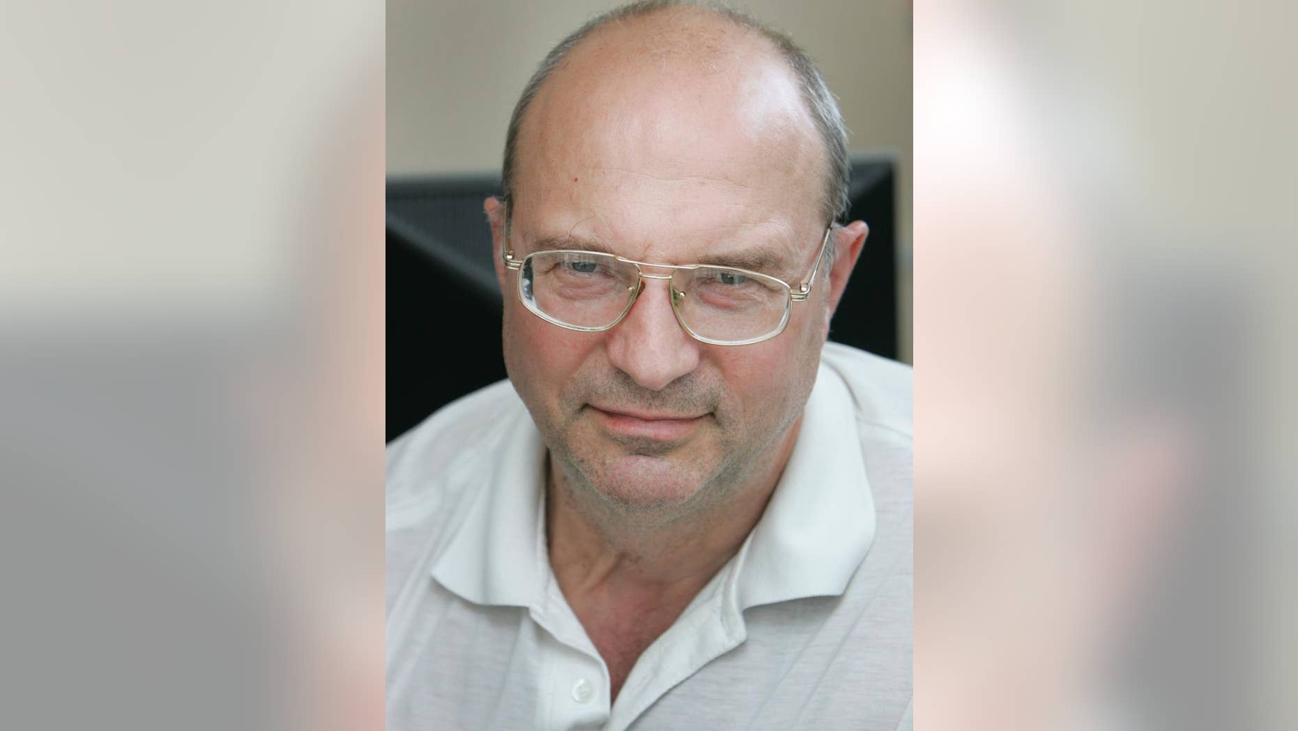 FILE - This is a June 17, 2008, file photo of Alexander Alesin, Belarusian prominent journalist and military analyst for a well-known weekly newspaper, in Minsk, Belarus. Alexander Alesin has been missing since Nov. 25 2014, when he was reportedly snatched in a cafe in the capital Minsk by unknown men. Belarusian police say Alesin who has been missing for nearly two weeks is being held in jail. (AP Photo/Sergei Grits, File)