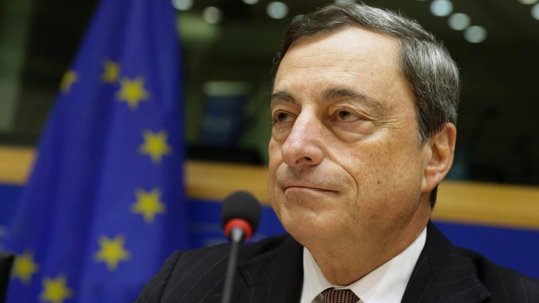 President of the European Central Bank Mario Draghi addresses the Committee on Economic and Monetary Affairs, at the European Parliament building, in Brussels on Monday, Nov. 17, 2014. (AP Photo/Yves Logghe)