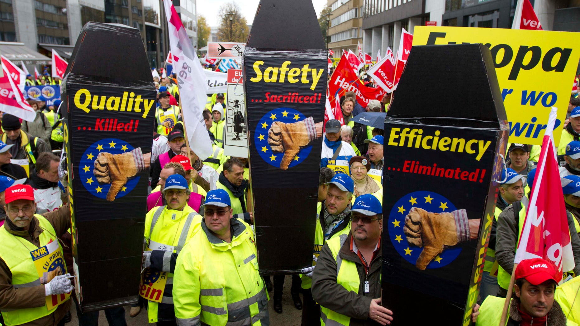 Nov. 5, 2012: Airport ground workers and baggage handlers demonstrate with messages on mock coffins in front of EU headquarters in Brussels.