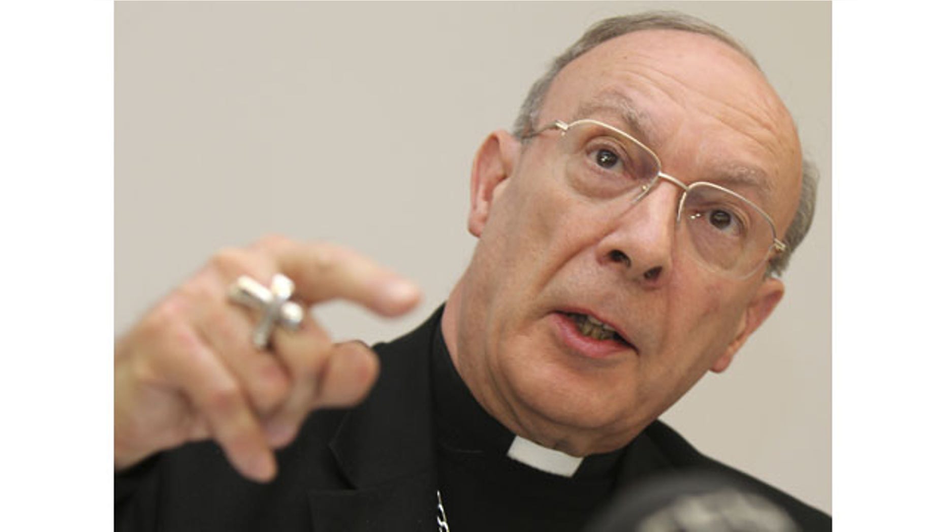 In this April 23, 2010, file photo, Belgium's Archbishop Andre-Joseph Leonard addresses the media in Brussels. In Belgium, where euthanasia is now legal for people over the age of 18, the government is considering extending it to children, something that no other country has done. During testimony Leonard said alternatives like palliative sedation make euthanasia unnecessary and this relieves doctors of the burden of having to kill patients. (AP Photo/Yves Logghe, File)