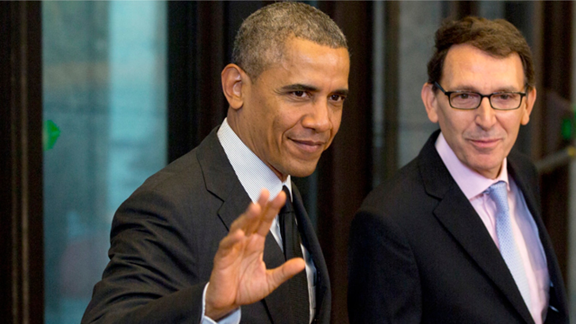 June 5, 2014: U.S. President Barack Obama, left, waves as he arrives for a G7 summit at the EU Council building in Brussels. The leaders of the G-7 group of major economies center their effort during the concluding day of their summit on spurring growth and jobs in an attempt to reinforce a rebound from the global financial crisis. (AP Photo/Virginia Mayo)