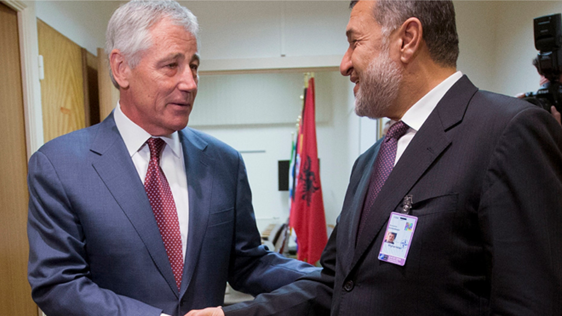 June 4, 2014: U.S. Defense Secretary Chuck Hagel, left, shakes hands with Afghanistan's Defense Minister Bismillah Khan Mohammadi, right, ahead of their North Atlantic Council (NAT) meeting, in Brussels. (AP)