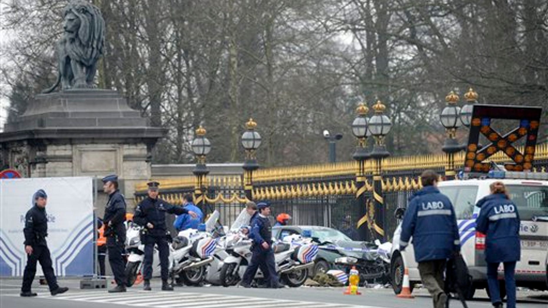March 13: Police stand at the scene of an accident in front of the Royal Palace in Laeken, Belgium.