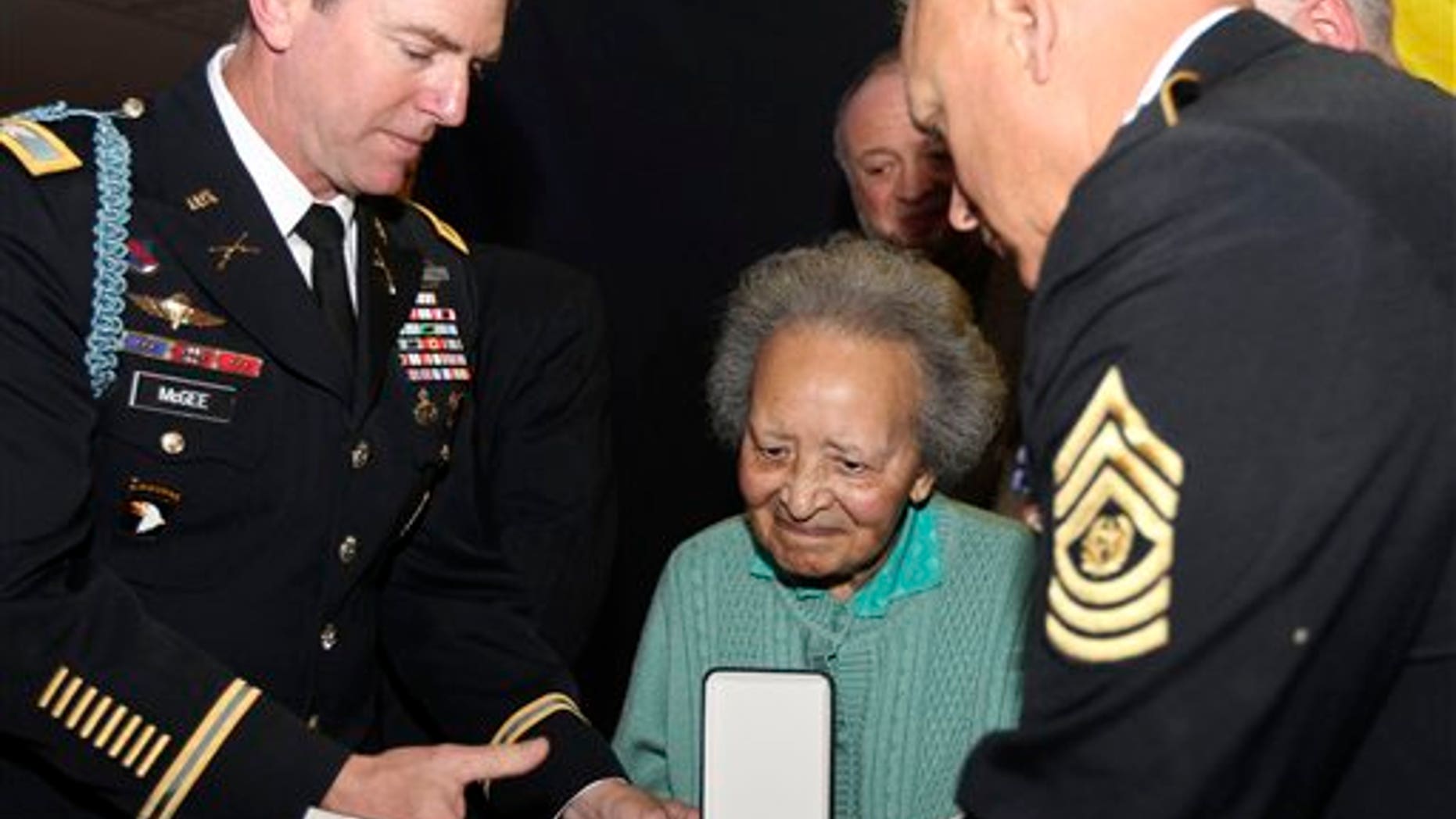 Dec. 12: Belgian nurse Augusta Chiwy, who saved hundreds of wounded GIs during the WWII Battle of the Bulge, receives an award for valor from the U.S. Army, in Brussels.