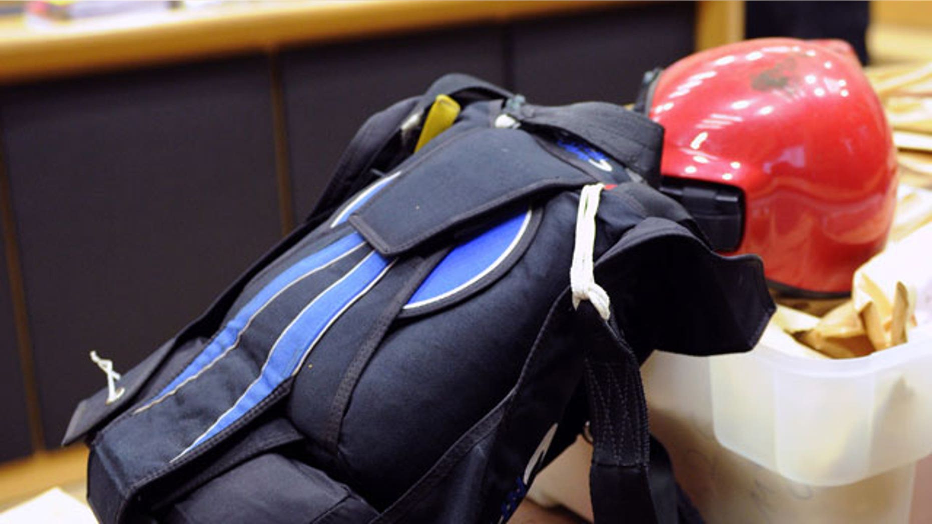 A parachute lays between other pieces of evidence as lawyers arrive at the courthouse in Tongeren, Belgium, Friday, Sept. 24, 2010. Friday, the trial into the death of a skydiver who crashed to earth because of a faulty parachute started. Els Clottemans, a lone suspect, faces murder charges and accusations that jealousy pushed her four years ago to sabotage the parachute of her close friend and rival Els Van Doren with whom she shared a passion for skydiving and a lover.