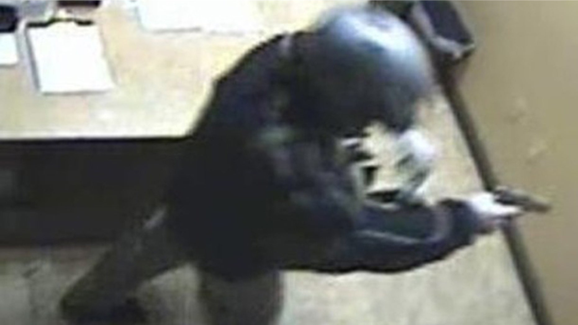 A man with a gun is shown at the scene of a robbery at the Las Vegas Suncoast Casino poker room cashier in this photo taken by surveillance camera on Dec. 9, and released by the Las Vegas Police Department (LVPD) to Reuters. LVPD believe the same man robbed the Bellagio Casino of $1.5 million in chips on Dec. 14 (Reuters).