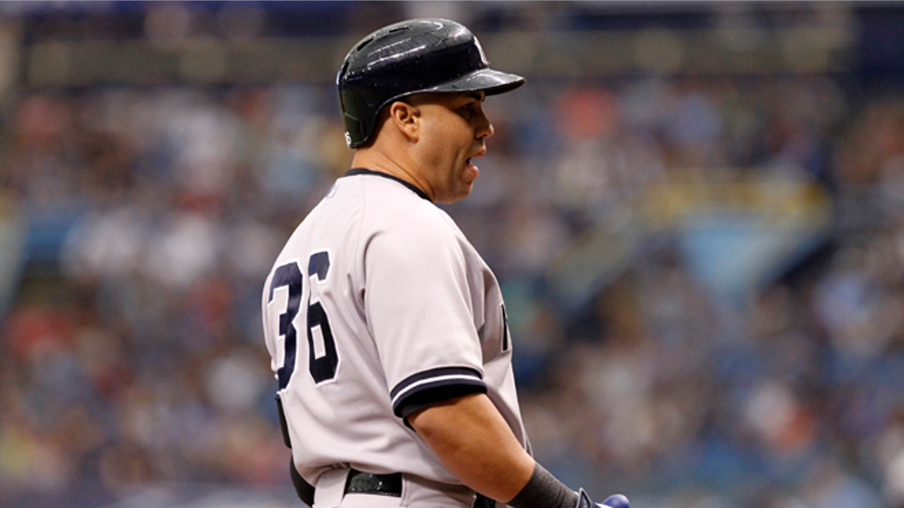 ST. PETERSBURG, FL - APRIL 20: Carlos Beltrán #36 of the New York Yankees questions a call after striking out looking to end the top of the first inning of a game against the Tampa Bay Rays on April 20, 2014 at Tropicana Field in St. Petersburg, Florida. (Photo by Brian Blanco/Getty Images)