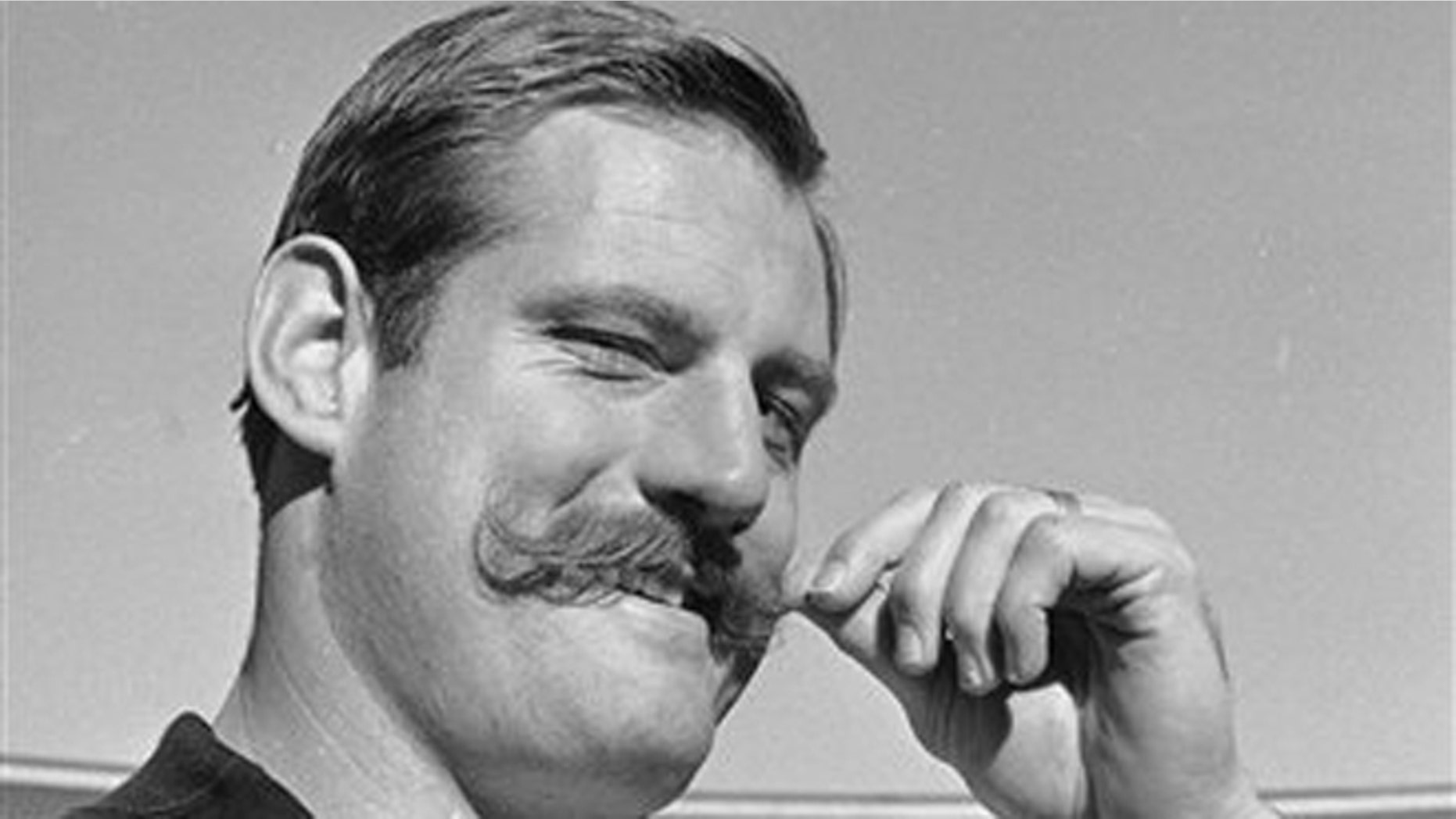 Jan. 3, 1968: In this file photo, Oakland Raiders defensive end Ben Davidson twirls his handlebar moustache in Oakland, Calif., as he contemplated the coming meeting with the Green Bay Packers in the NFL championship game.