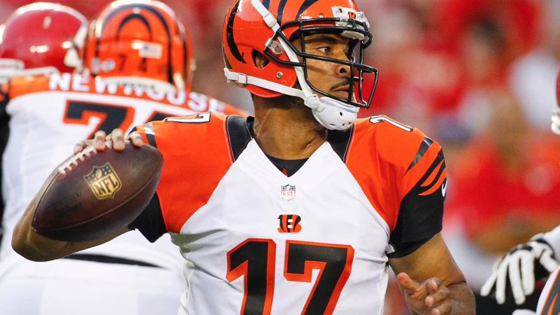 Cincinnati Bengals quarterback Jason Campbell looks for a receiver in the first half of an NFL preseason football game against the Kansas City Chiefs on Thursday, Aug. 7, 2014, in Kansas City, Mo. (AP Photo/Colin E. Braley)