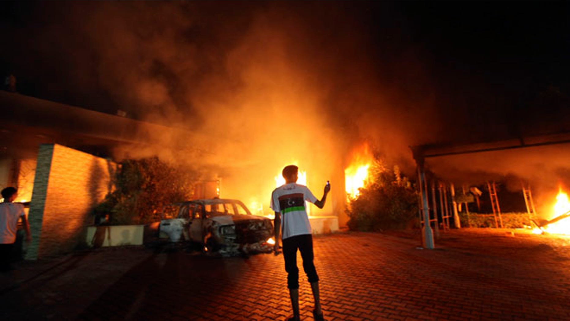 Sept. 11, 2012: The U.S. Consulate in Benghazi is seen in flames during a protest by an armed group said to have been protesting a film being produced in the United States.