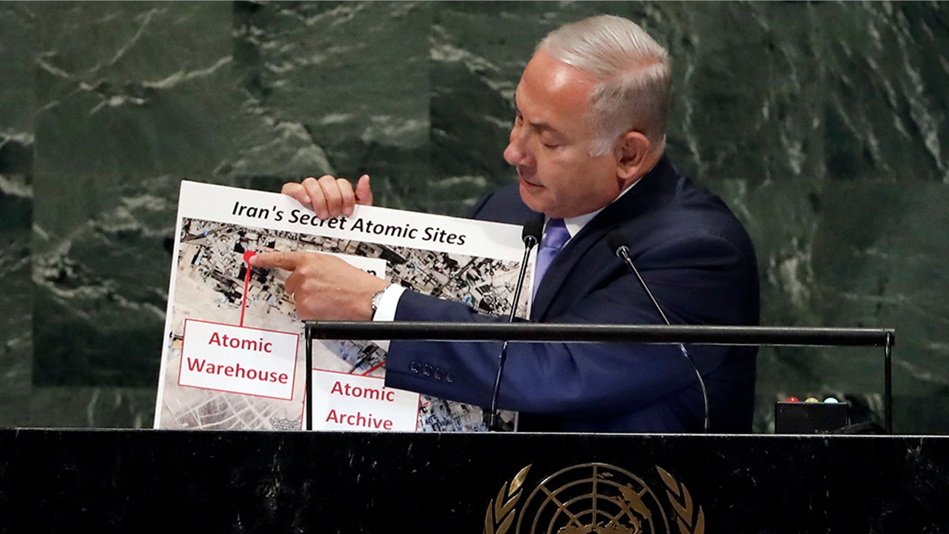 Israel's Prime Minister Benjamin Netanyahu shows an atomic warehouse in Tehran during his address at the 73rd session of the United Nations General Assembly on Thursday.